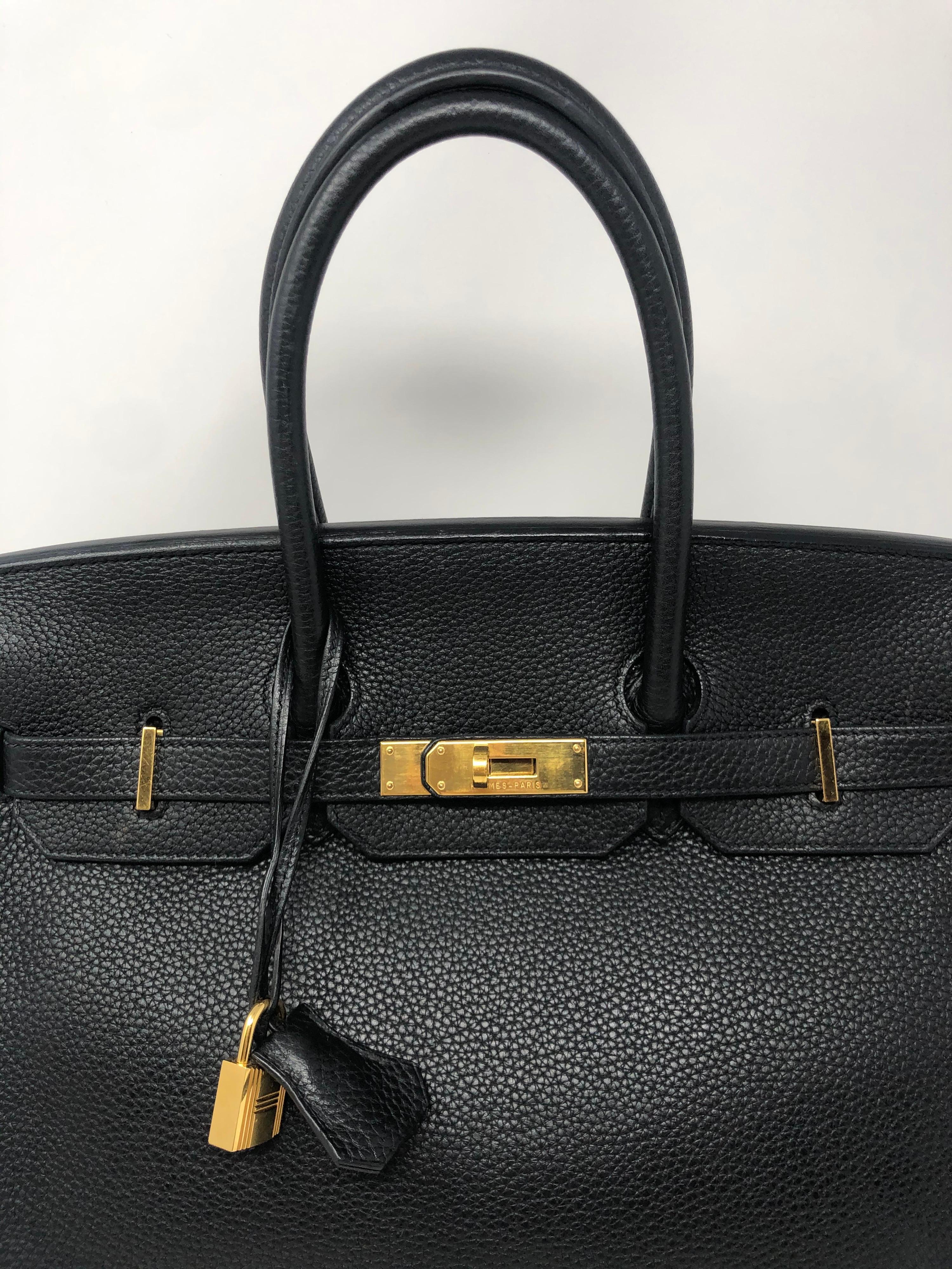 Hermes Black Birkin 35. Gold hardware. Good condition. From 2012. Hard combination to find Black and gold. Togo leather. Full set included. Dust cover, box, clochette, lock and keys. Guaranteed authentic. 