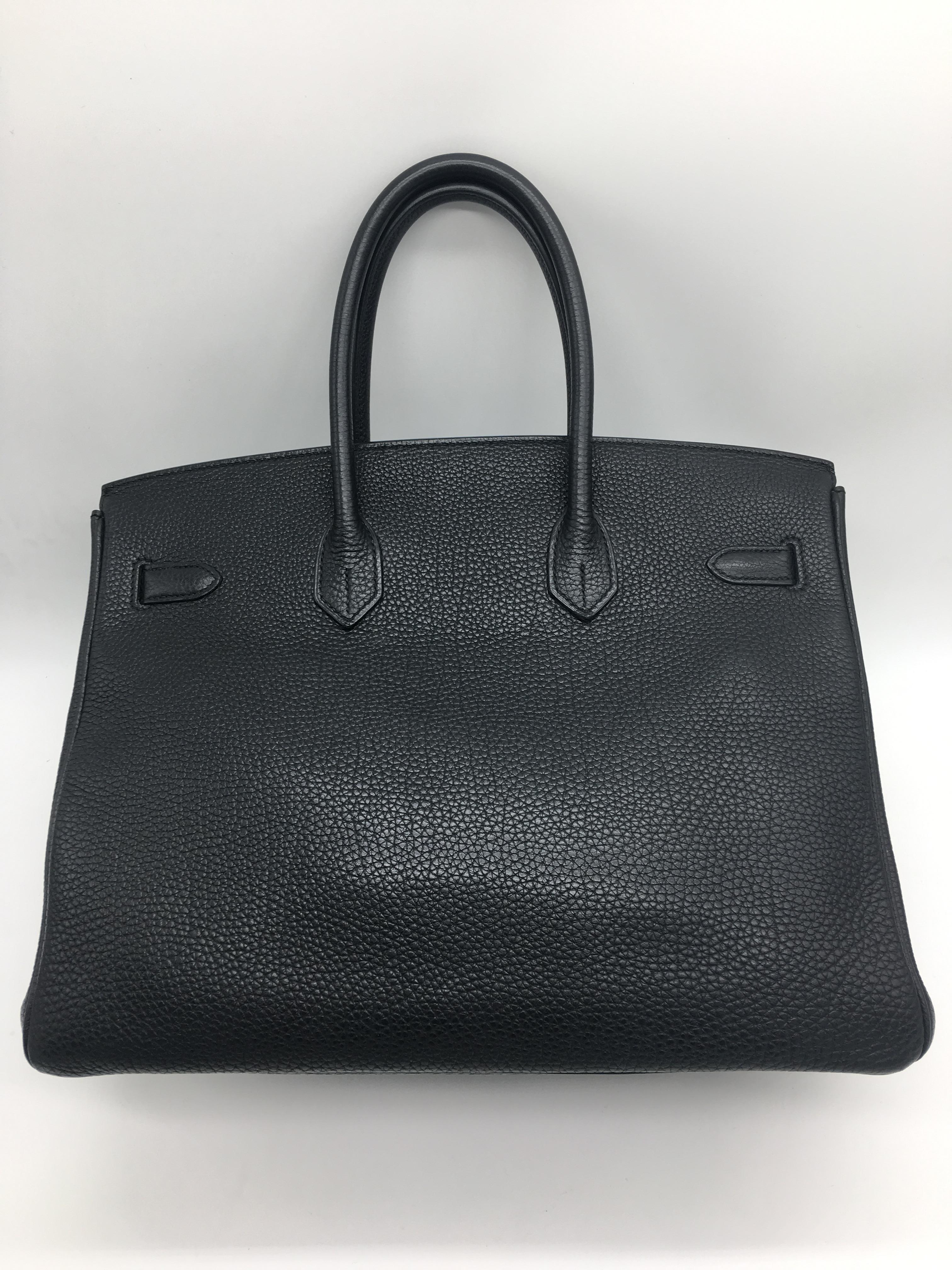 A 35cm black Hermes Birkin handbag in Togo Leather with Palladium Hardware. The classic bag for absolute elegance!  Full measurements are 35cm x 25cm high x 18cm deep. The handles are 10cm high.
It's in excellent condition, the only signs of use