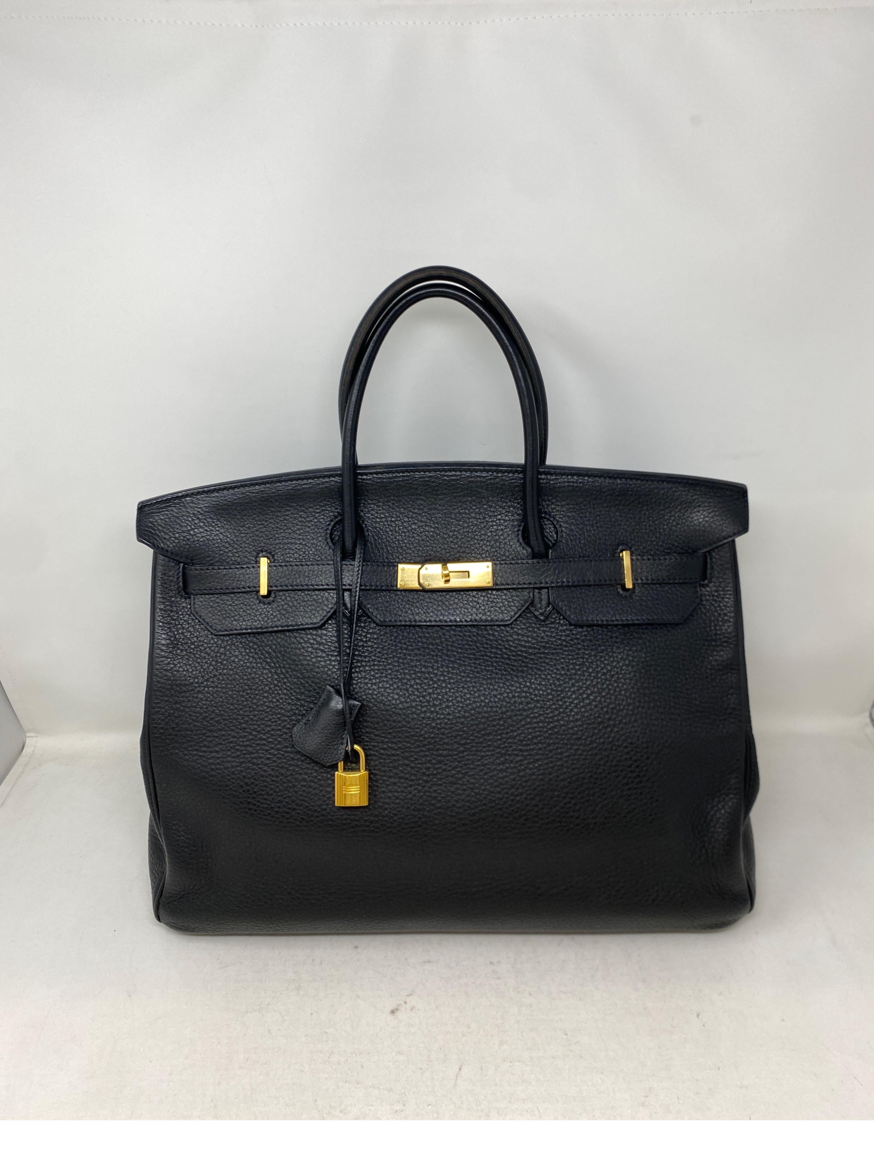 Hermes Black Birkin 40 Bag. Hard to find size 40 Birkin. Great as a bag or as a travel piece. Computer and work bag. Black with gold hardware. Togo leather. Durable leather. Good condition. Light wear on handles. Interior clean. Don't miss out on
