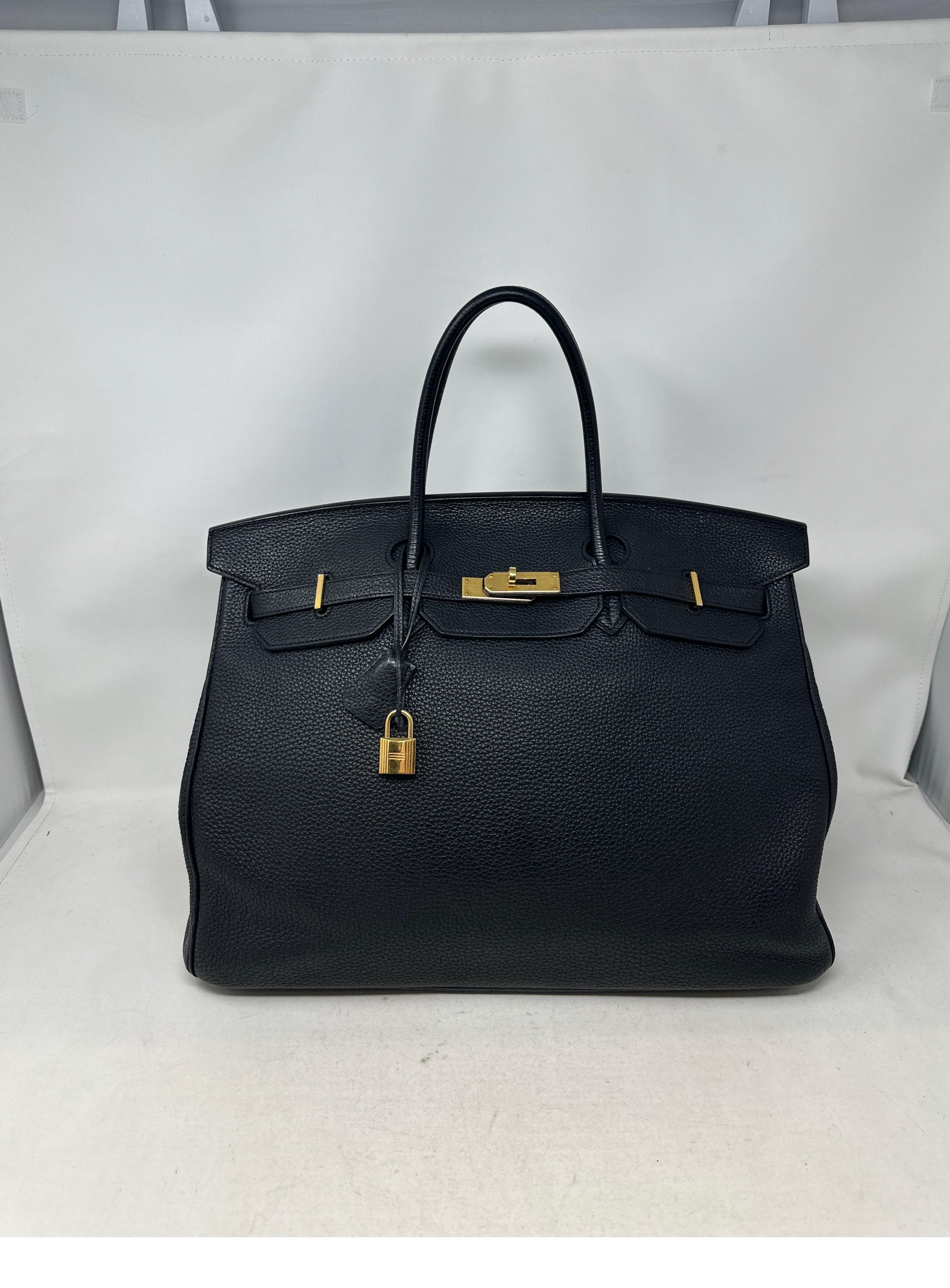 Hermes Black Birkin 40 Bag. Excellent condition. Togo leather. Gold hardware. Interior is clean. The 40 size is retired now. Rare size and most wanted combination. Includes clcohette, lock, keys, and dust bag. Guaranteed authentic. 