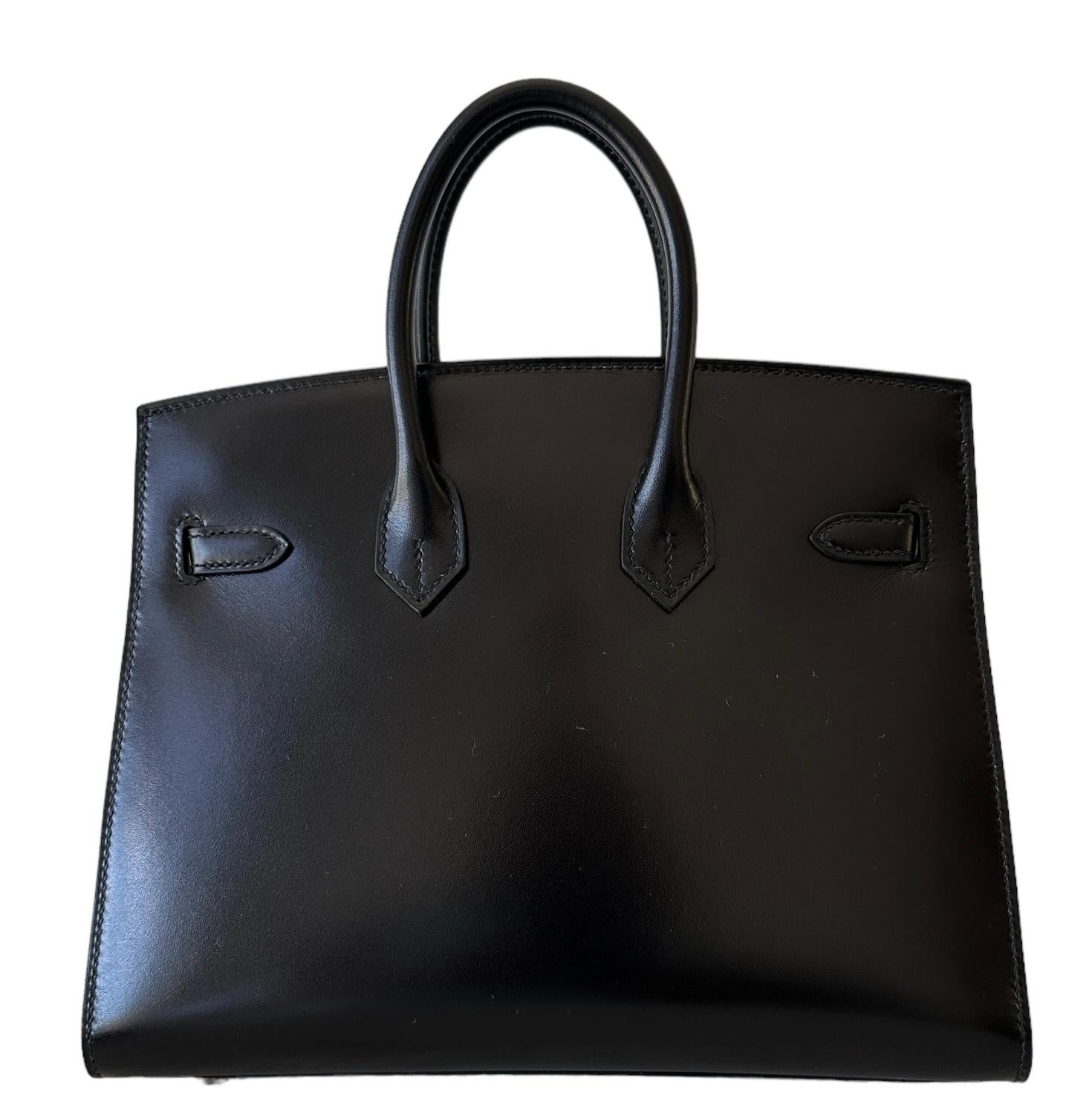 Hermes Birkin 25cm
Sellier Black 
Collectors Dream Bag
Very rare to find Box Leather especially in a Birkin 25 Sellier
Highly Sought after by Hermes Collectors
Gold Hardware
Understanding a Sellier Birkin 
The Hermes Birkin is a luxury handbag from