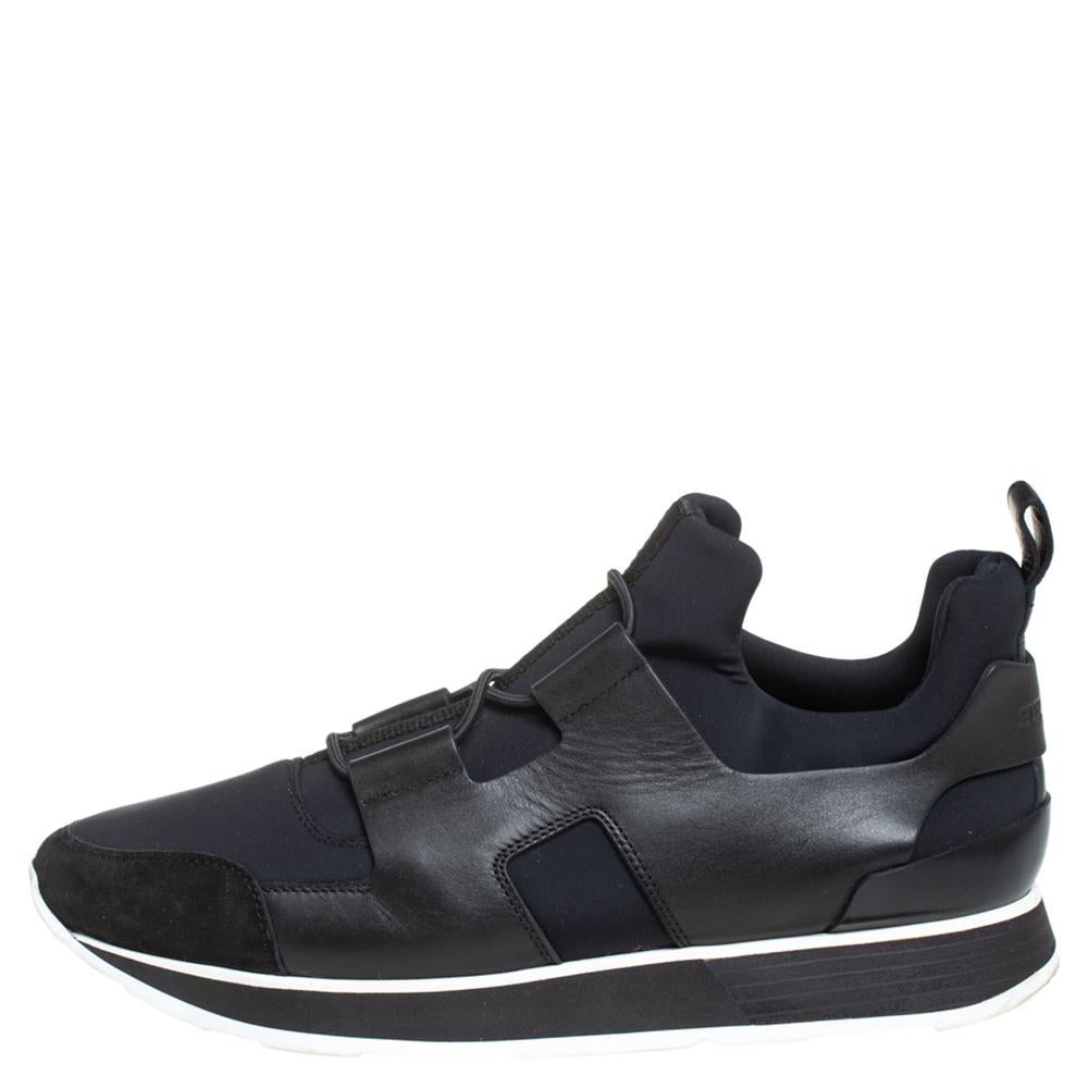These black & blue sneakers from Hermes are perfect for days when you wish for comfort and style! The low-top sneakers are crafted from leather and nylon and feature round toes, straps on the vamps, and tough rubber soles. They are finished with