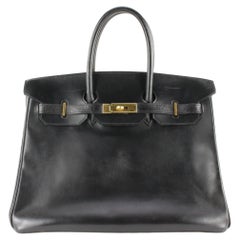 Schwarze Schachtel aus Kalbsleder von Hermès 35 GHW 1H0113