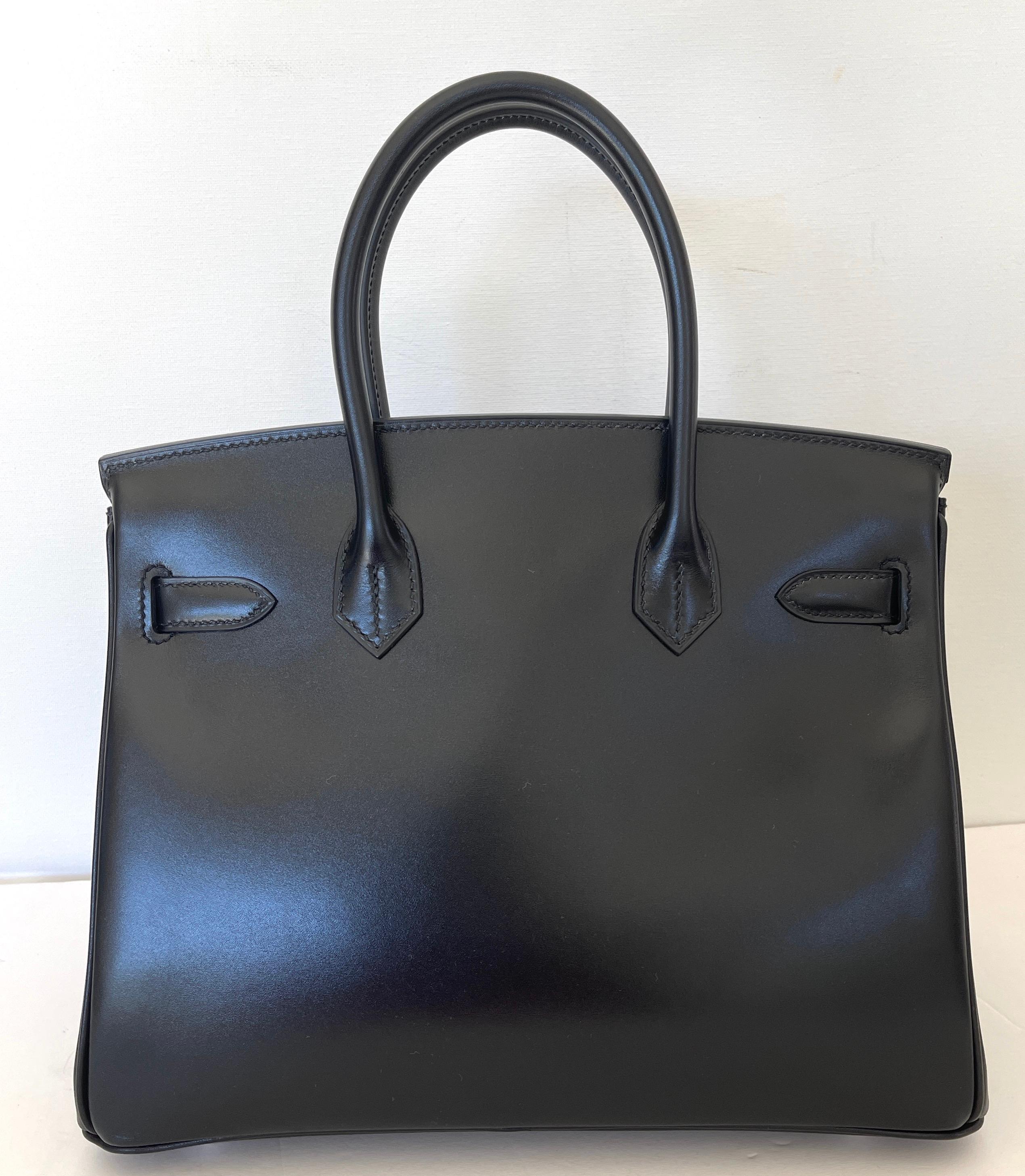 Birkin 30

Black Box Calfskin
Birkin 30cm
Palladium Hardware
Purchased in 2020 from Hermes 
Brand new storefresh
Ready for giftgiving
The perfect gift for the Hermes Collector

Plastic on the hardware
Box leather is very rare to find in a Birkin,