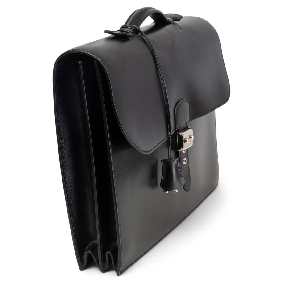 100% authentic Hermès Sac a Depeche briefcase in black Box Leather. Opens with a Palladium closure. Interior is divided into two sections with one open pocket against the front. Has been carried and is in excellent condition. Comes with keys,