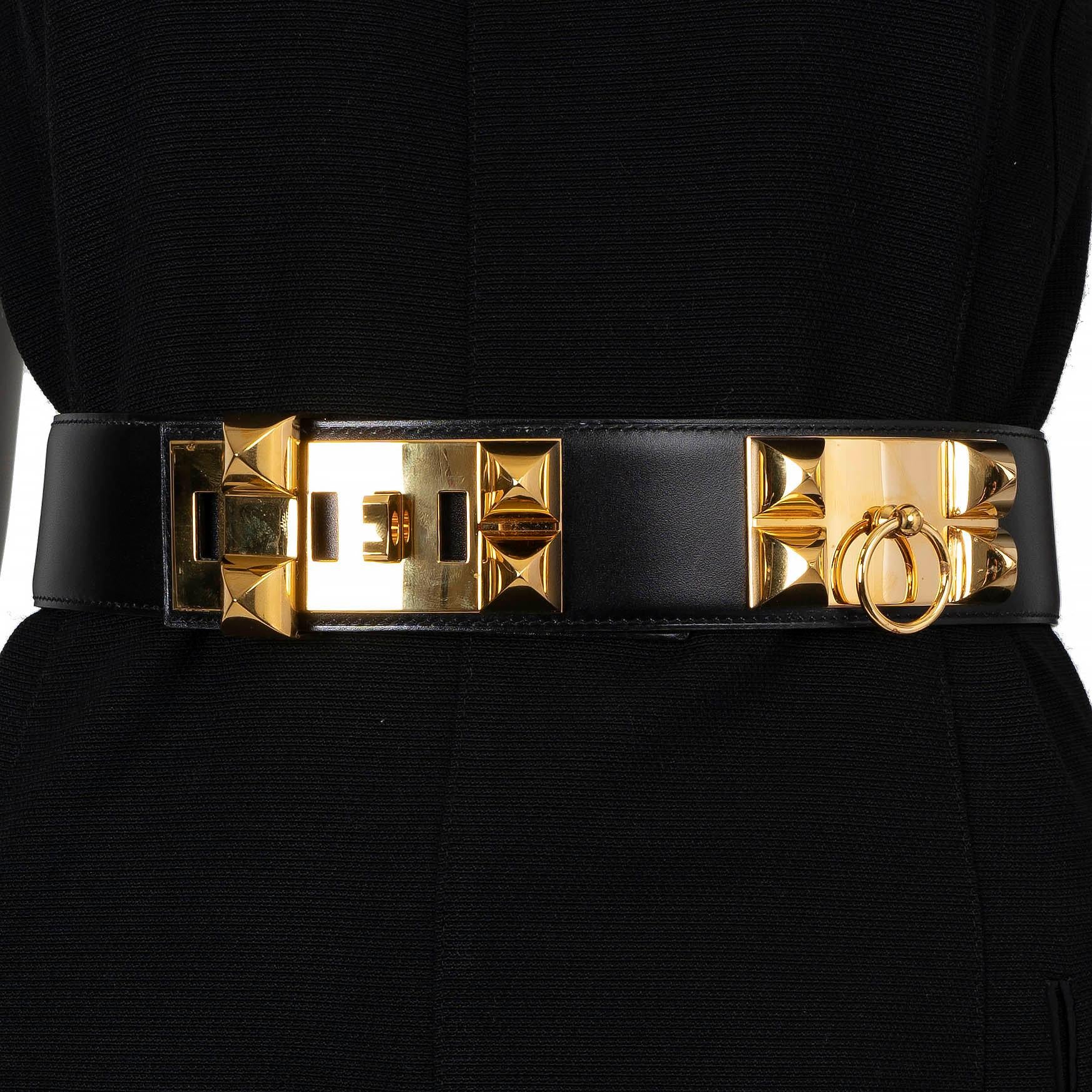 This 100% authentic Hermès Collier De Chien waist belt is crafted from luxurious black Box leather and features iconic gold-tone hardware. A statement piece with timeless appeal, this belt adds an edge of sophistication and elegance to any ensemble.