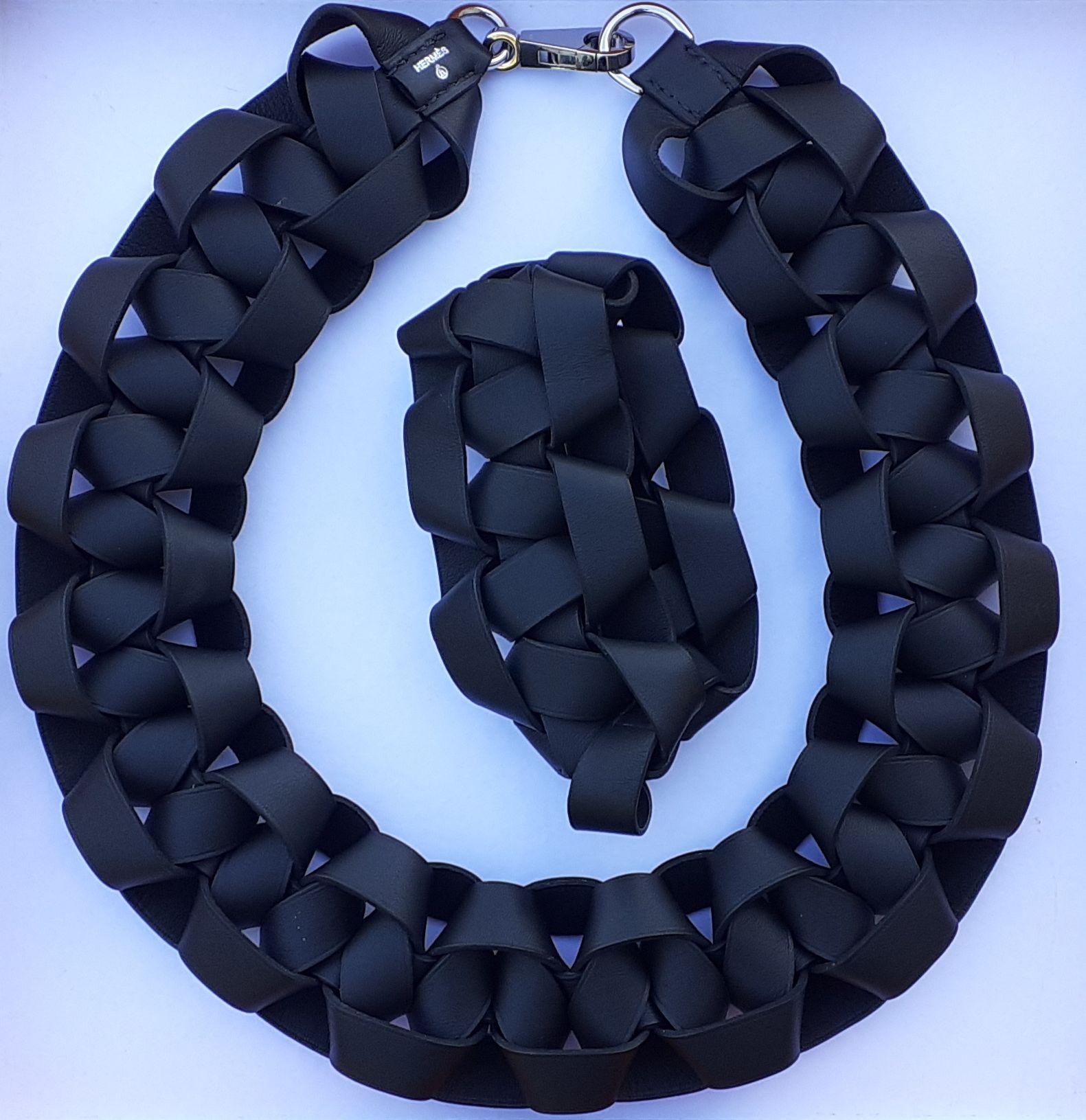 Rare and Beautiful Authentic Hermès Set

Includes 1 necklace and 1 matching bracelet

Pattern: sophisticated braid

Made of Smooth Leather and clasp in Palladium Plated Hardware

Colorways: Black, Silver

The bracelet does not open, it should be