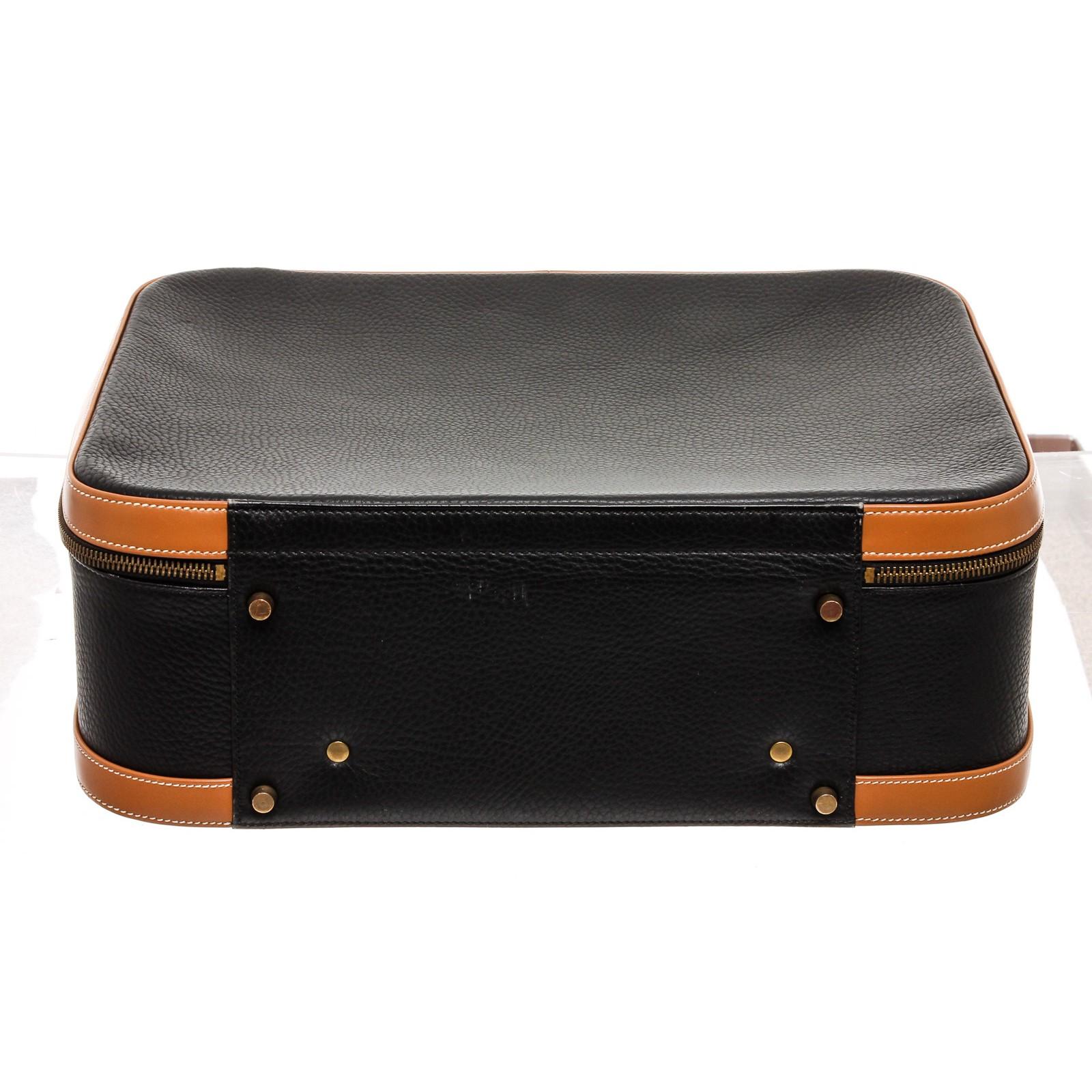 black and brown suitcase