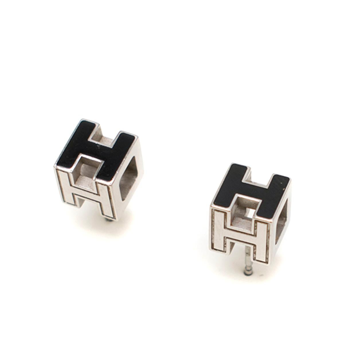 Hermes Black Cage d'H Earrings

- Black stud earrings 
- Cubical Cage-shaped with H
- Silver plated Palladium base 
- Black enamel detail 
- Stopper carried hermes insignia and features engraved logo

This item comes with an additional dust bag and