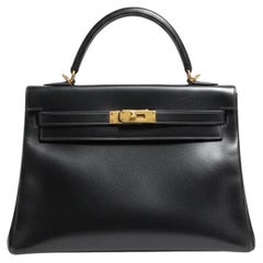 HERMÈS BLACK CALF BOX LEATHER RETOURNÉ KELLY 32 WITH GOLD PADLOCK and KEY HERMÈS BLACK CALF BOX LEATHER RETOURNÉ KELLY 32 WITH GOLD PADLOCK and KEY