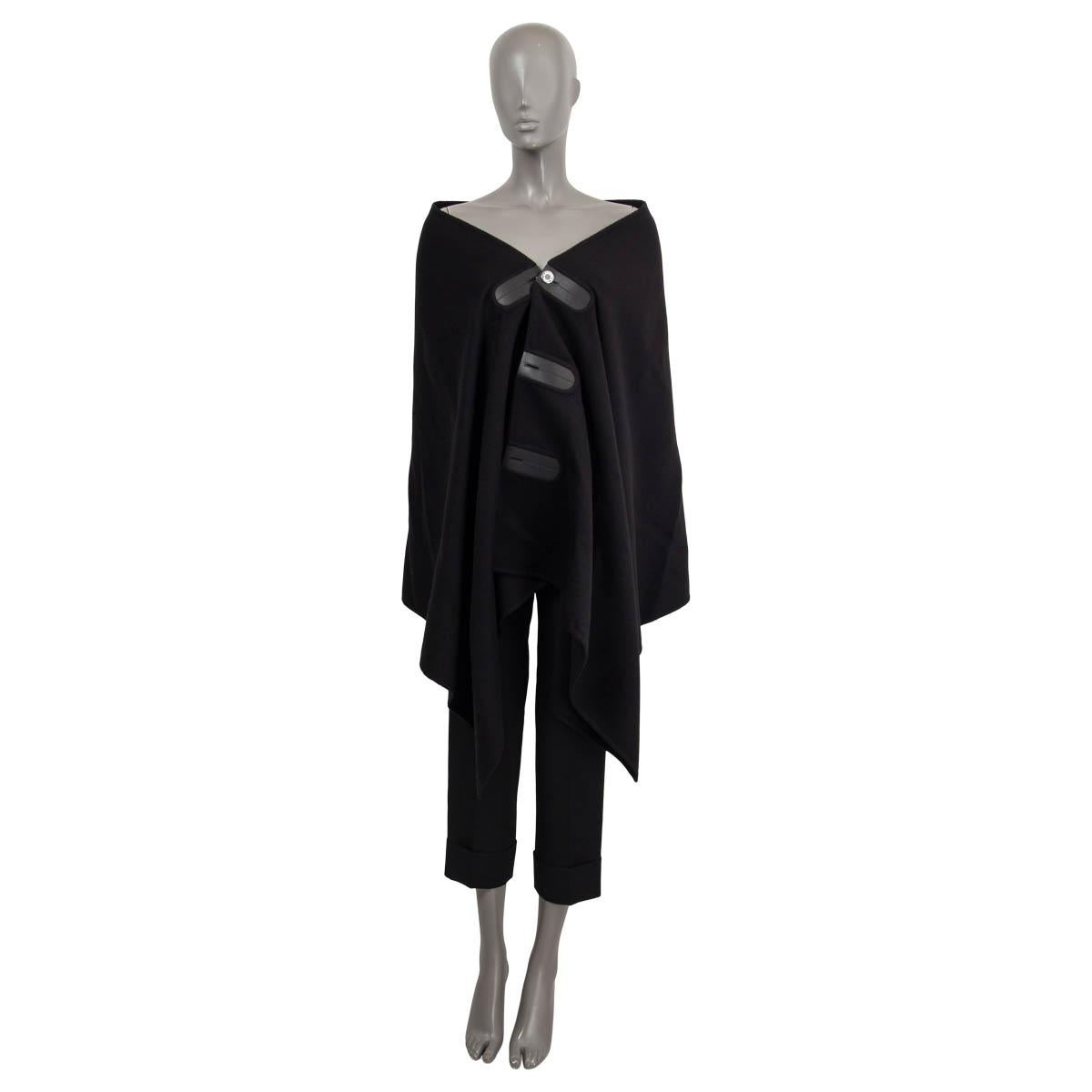 100% authentic Hermès cape in black cashmere (100%) with black leather trims. Opens with one variable silver-tone 'Hermès' button on the front. Unlined. Has been worn once and is in virtually new condition.

Measurements
Tag Size	One Size
Size	one