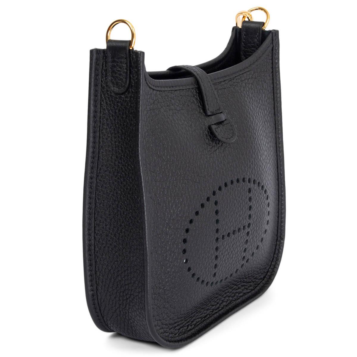 This 100% authentic Hermès Evelyne 16 Amazone crossbody bag in Noir (black) Taurillon Clemence leather is the perfect blend of practicality and effortless elegance. Featuring the iconic perforated 