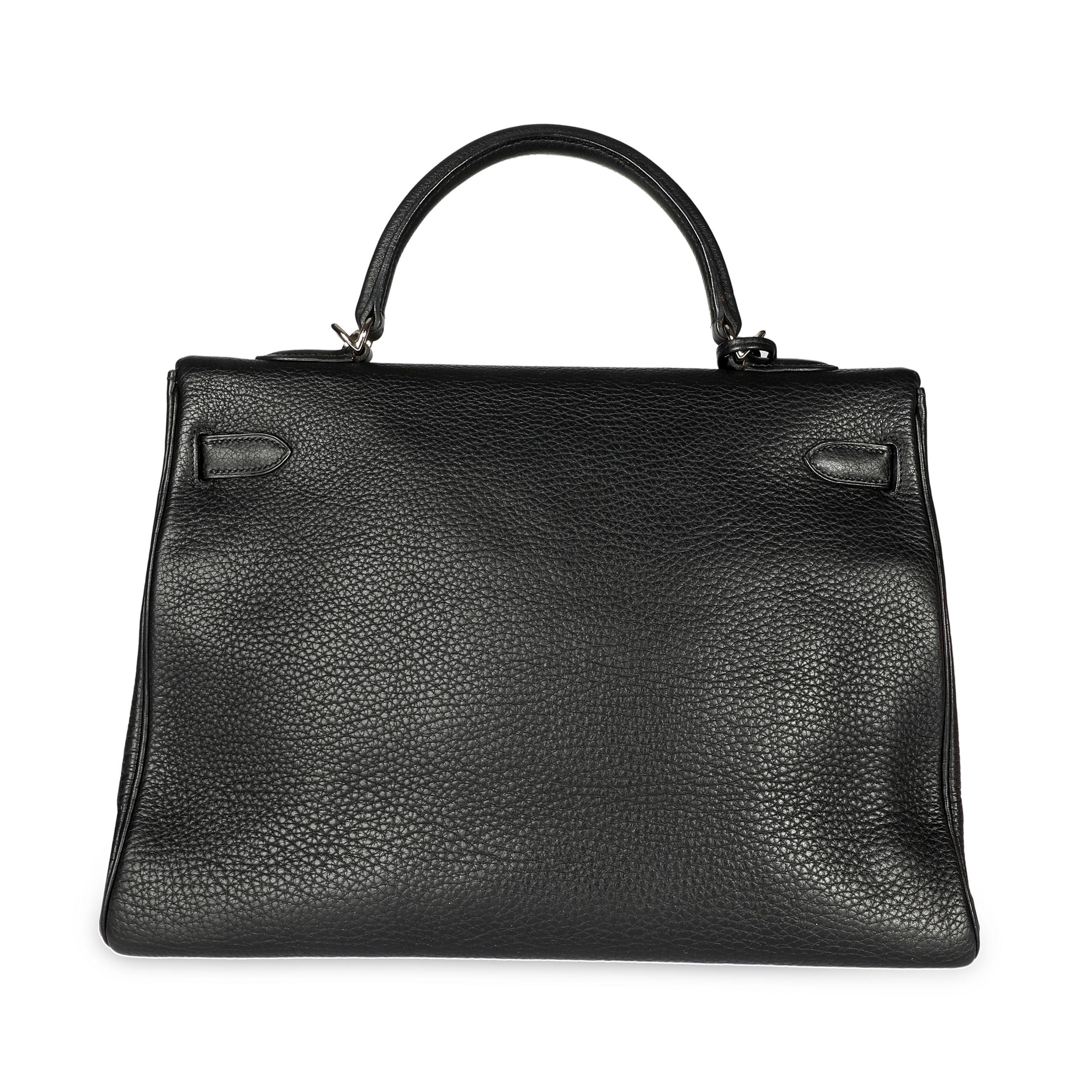 Hermès Black Clémence Retourne Kelly 35 PHW
SKU: 108488

Handbag Condition: Very Good
Condition Comments: Very Good Condition. Light scuffing to corners. Scratching and tarnishing to hardware. Marks on interior. Faint perfume odor.
Brand: