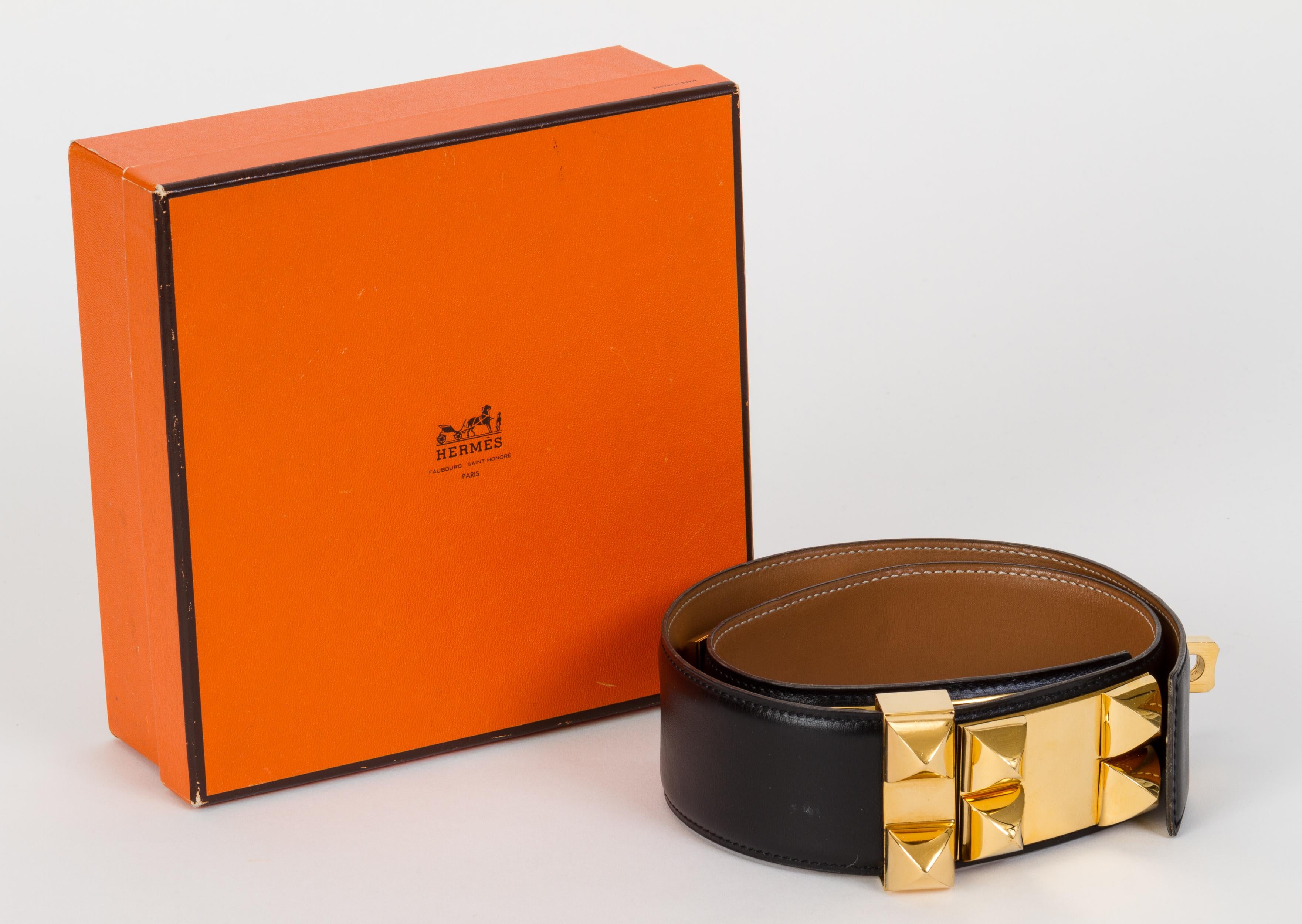 Hermès iconic Collier de Chien belt. Black box calf leather and gold-plated rhodium metal. Size 65 cm. Dated 