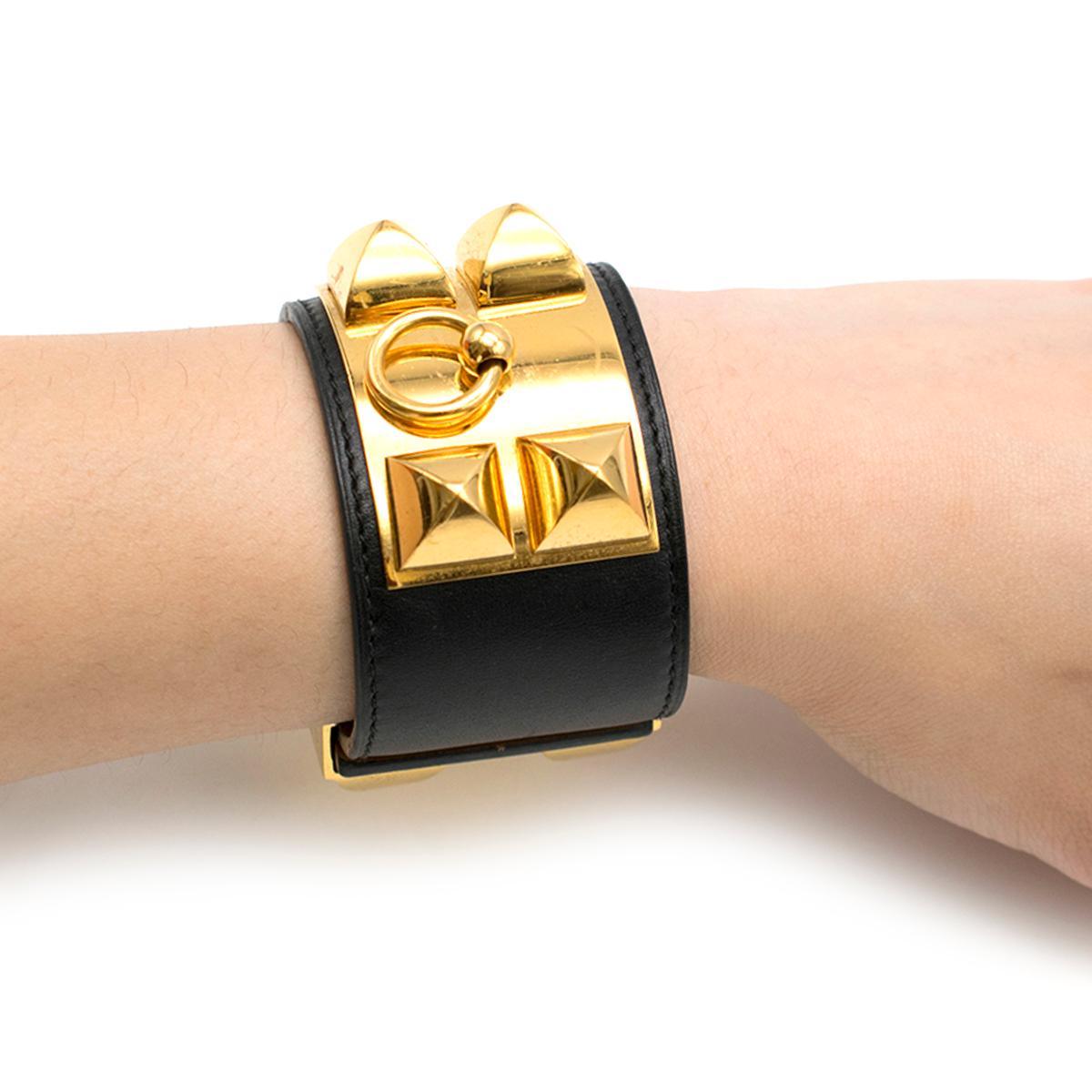 Hermes Black Collier de Chien Bracelet

- material- calfskin leather
- gold plated Medor pyramid studs and ring
- adjustable closure 
- this item comes with an additional dustbag and box

Please note, these items are pre-owned and may show some