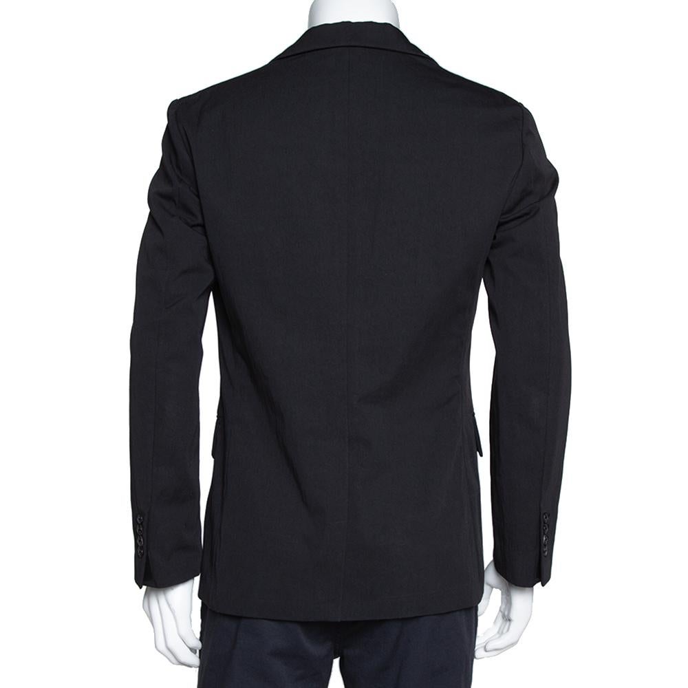 This Hermes jacket is designed to lift your wardrobe. The cotton blend creation features notched lapels, front buttons, and a subtle black exterior. Tailored to fit you perfectly, this piece will offer a smart, formal look.

