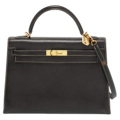 Sac Hermès Kelly Sellier 32 en cuir Courchevel noir finition dorée