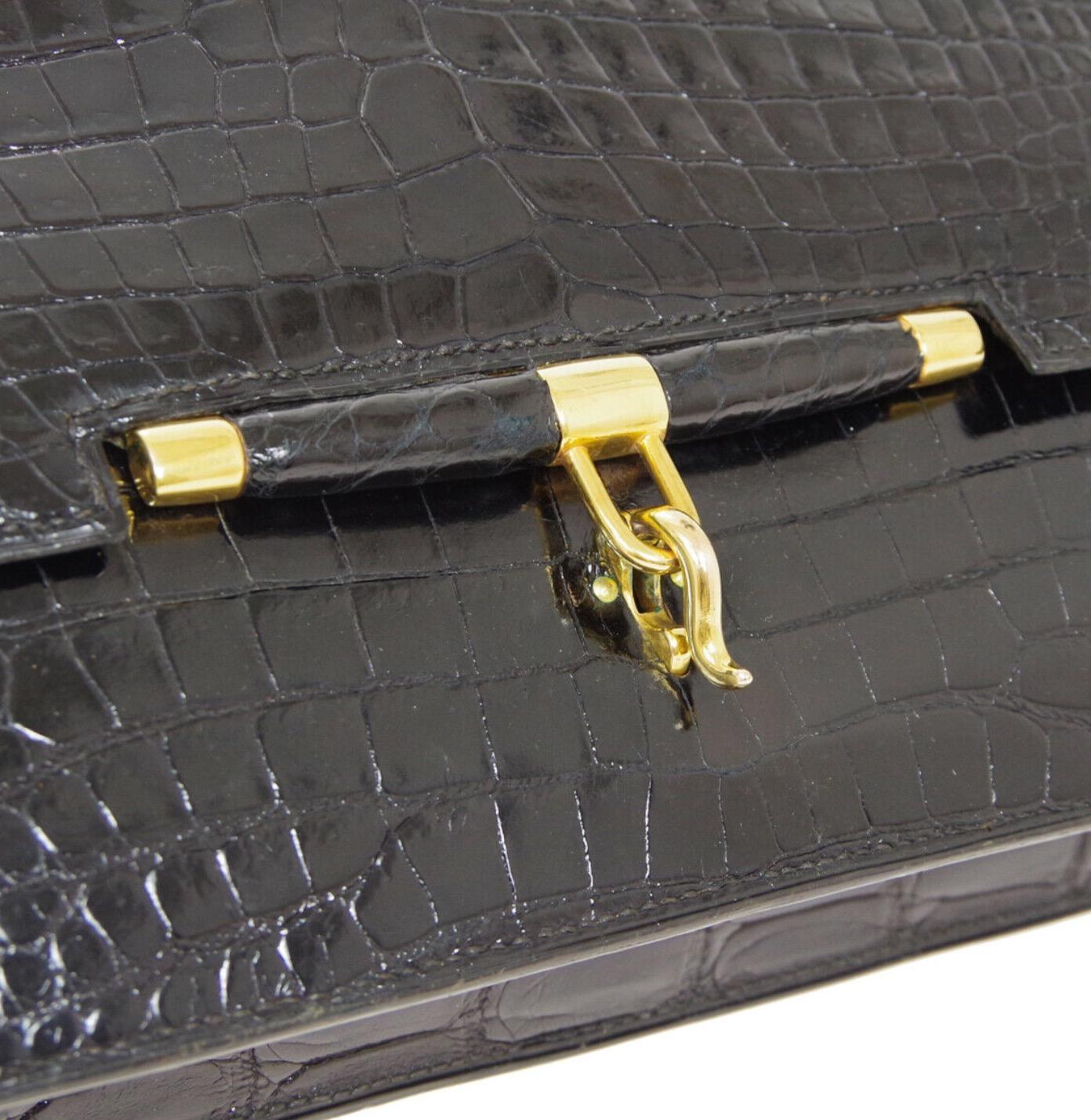 Hermes Black Crocodile Exotic Leather Gold Top handle Satchel Kelly Flap Bag

Crocodile
Gold tone hardware
Leather lining
Made in France
Handle drop 5.5