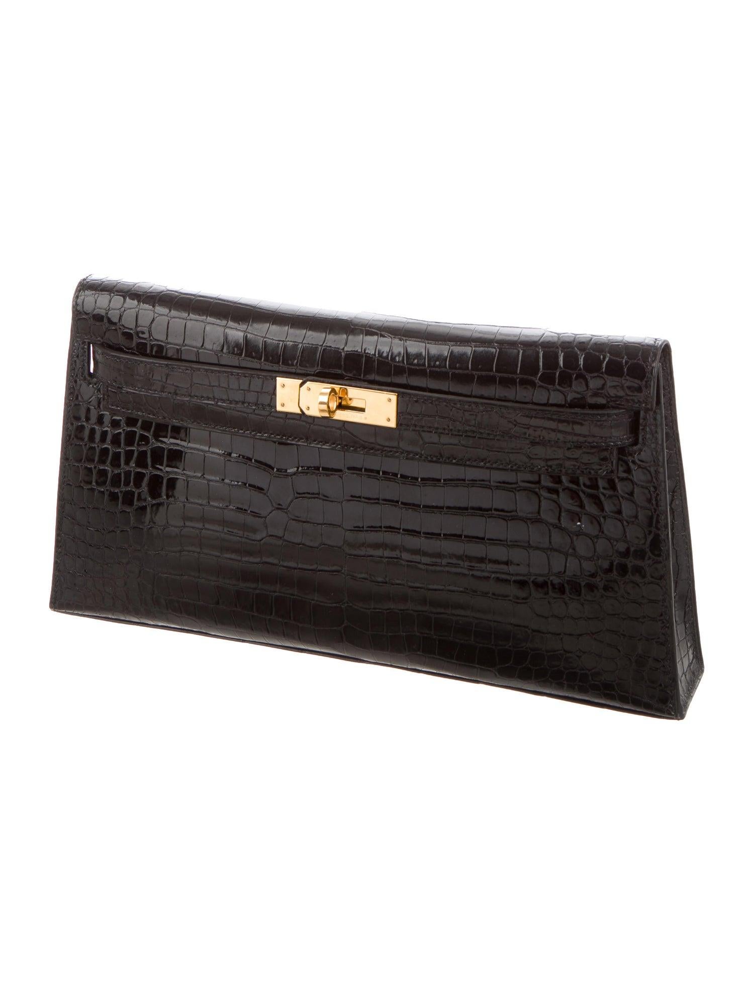 Hermes Black Crocodile Leather Gold Top Handle Satchel Kelly Evening Clutch Flap Bag

Crocodile
Gold-plated hardware
Leather lining
Turn-lock closure
Measures 10