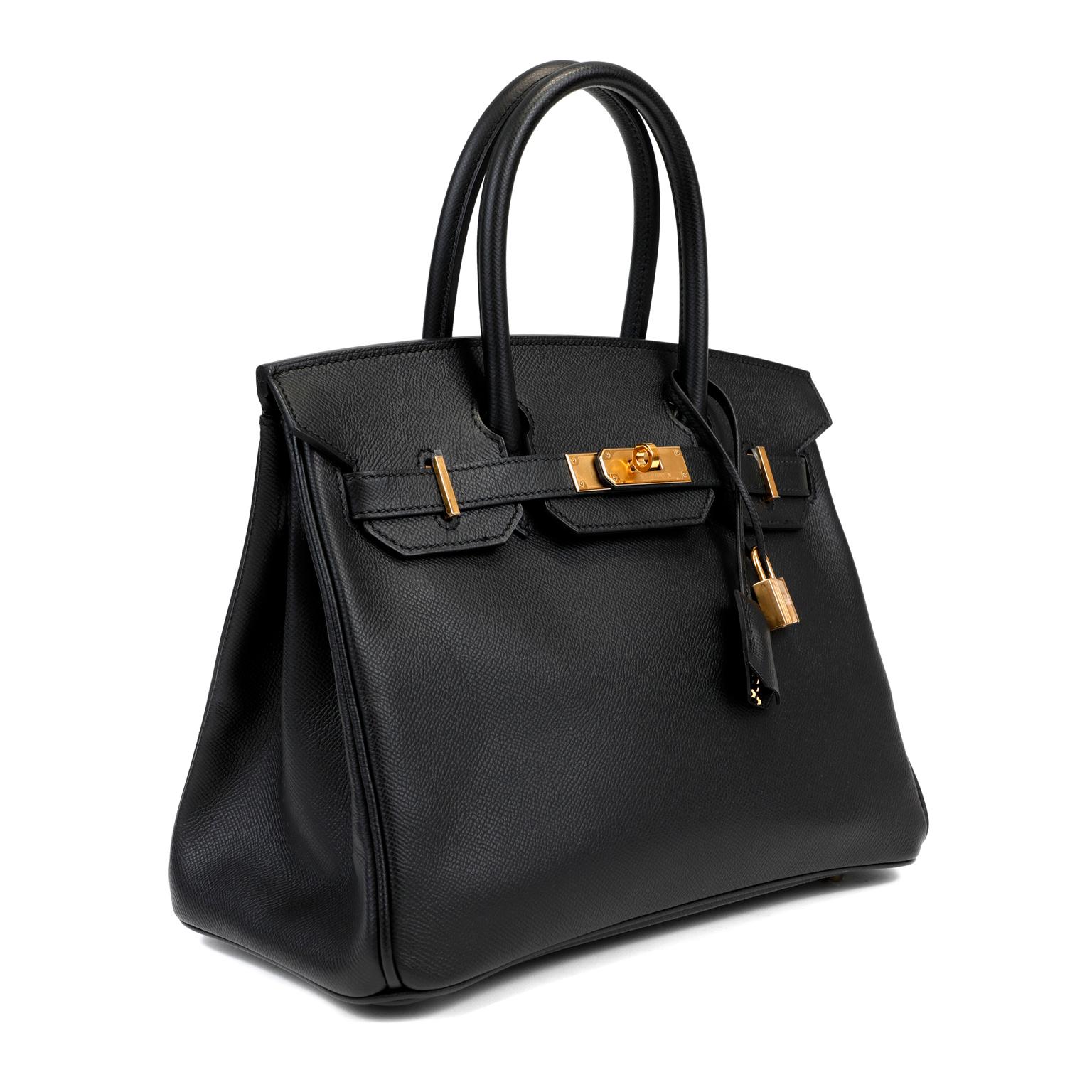 This authentic Hermès Black Epsom 30 cm Birkin is in pristine unworn condition; the protective plastic is still intact on the hardware.    Considered the ultimate luxury item, the Hermès Birkin is stitched by hand. Waitlists exceeding a year are