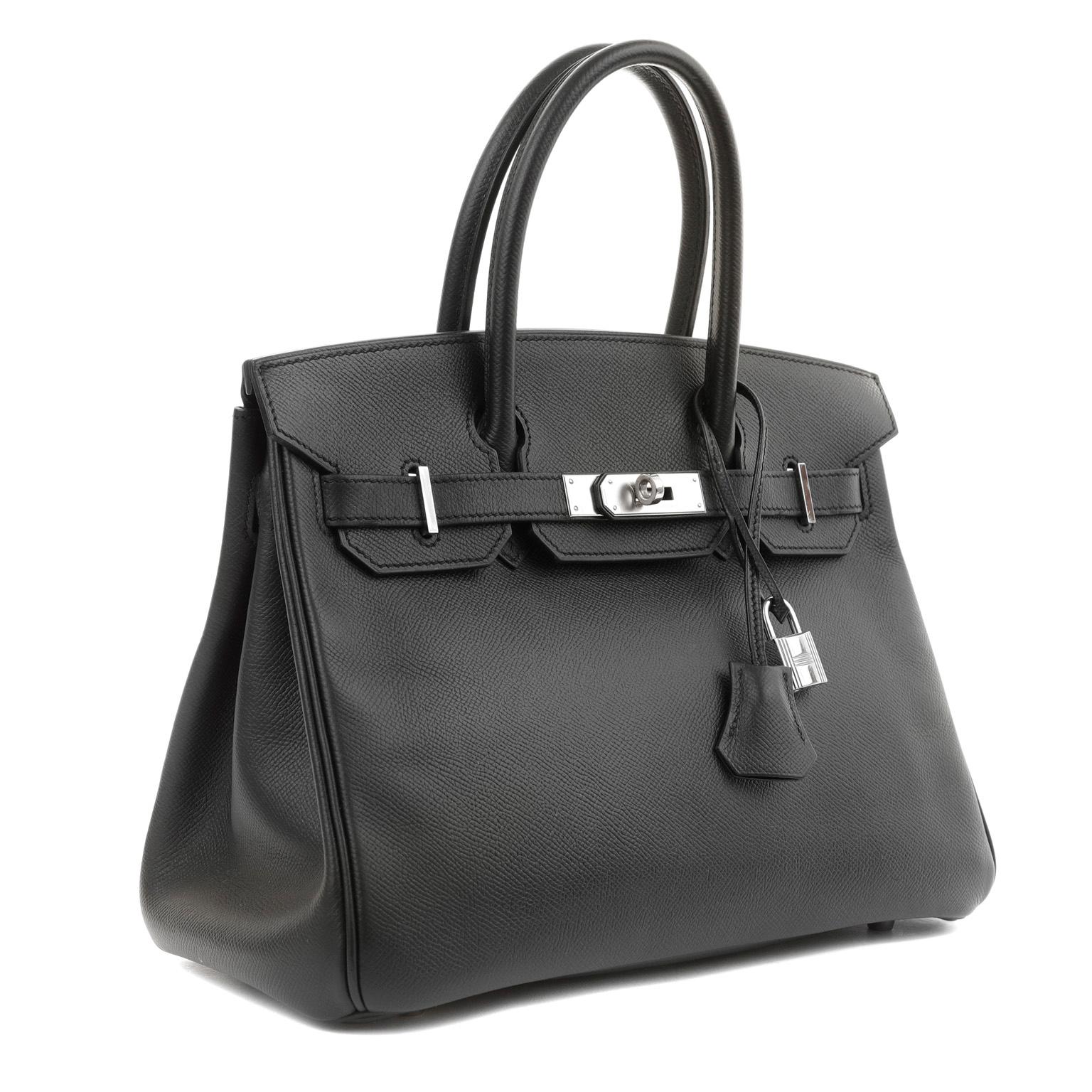 This authentic Hermès Black Epsom 30 cm Birkin is in pristine unworn condition; the protective plastic is still intact on the hardware.    Considered the ultimate luxury item, the Hermès Birkin is stitched by hand. Waitlists exceeding a year are