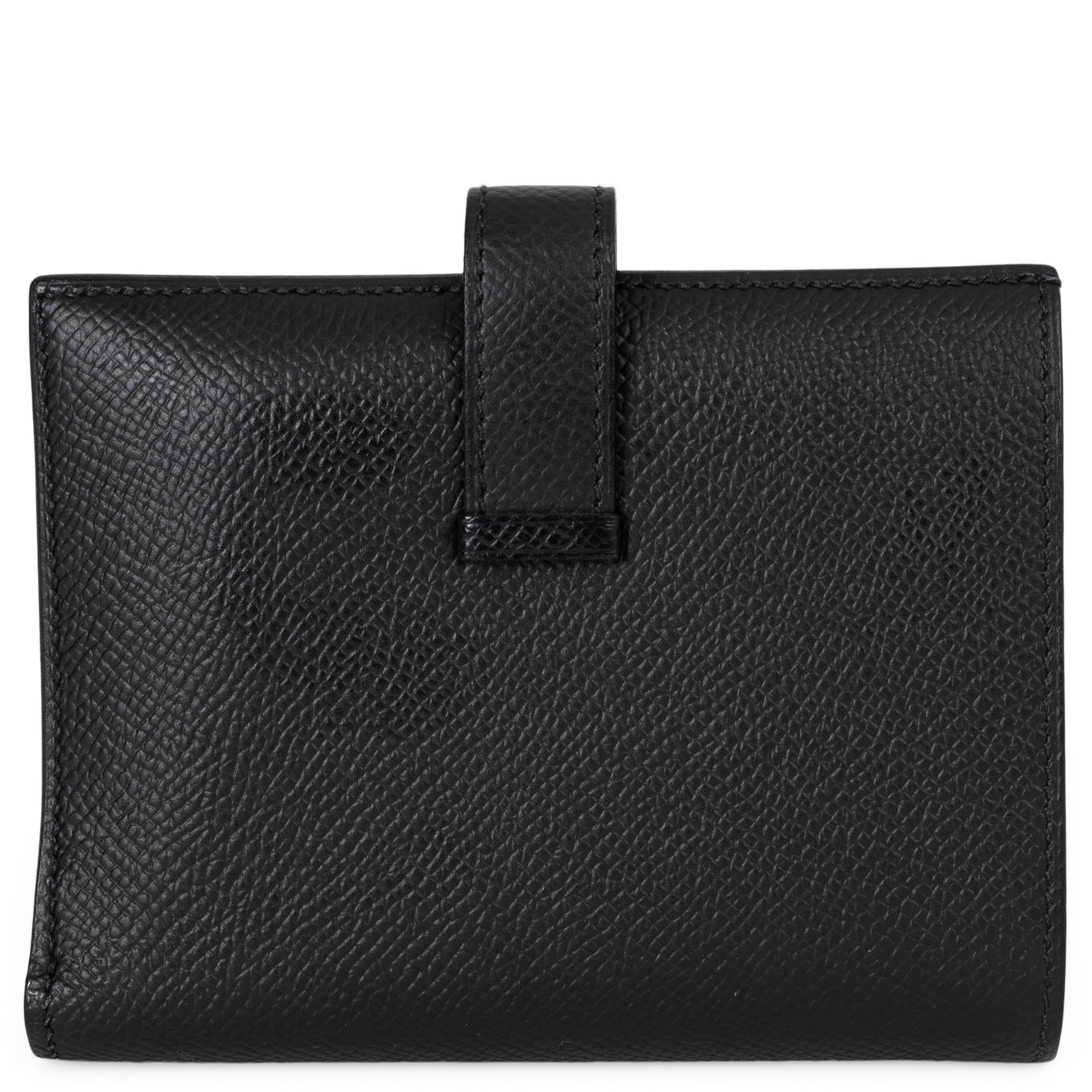 This 100% authentic Hermès Bearn Compact wallet in black Veau Epsom leather is a timeless accessory of refined craftsmanship. Featuring a structured silhouette, it closes with a leather tab and palladium openwork H closure. The interior is lined in
