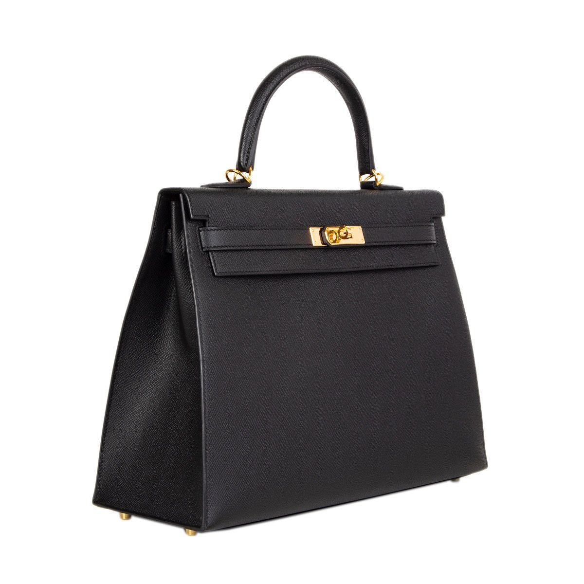 Hermes 'Kelly II 35 Sellier' in black Veau Epsom leather with gold-plated hardware. Removable shoulder strap. Closes with a turn-lock and straps on the front. Lined in Chevre (goat skin) with two open pockets against the front and a zipper pocket