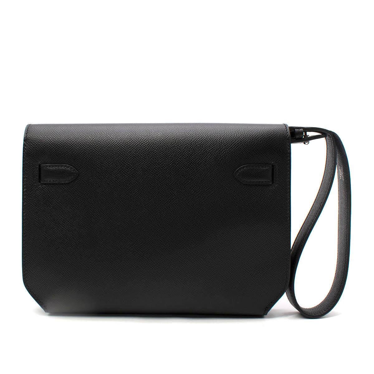 - Classic Kelly turnlock closure
- Palladium hardware
- Crafted from Epsom calfskin leather
- Leather wristlet strap 
- Tonal black leather interior with a front pocket and silver foil embossed logo
- Curved bottom edges

Materials:
Epsom