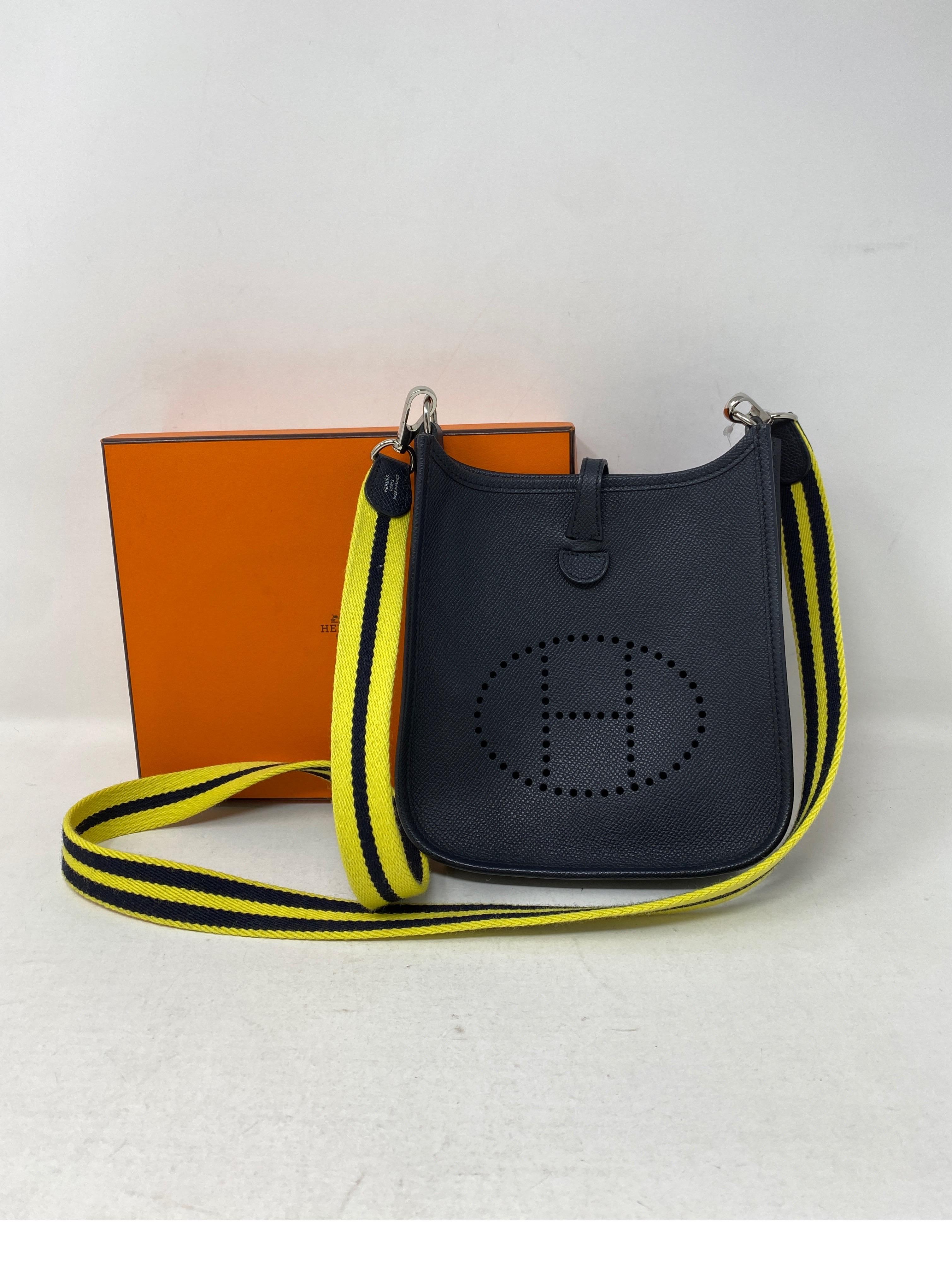 Hermes Evelyne Black TPM Bag. Mini size Hermes Evelyne. Rare and hard to find. Unique yellow and black stripe strap. Mint condition like new. Includes Hermes Box. Guaranteed authentic. 
