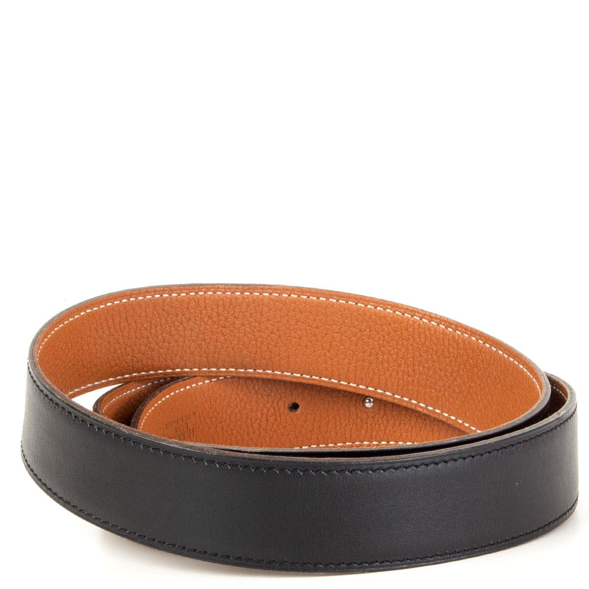 100% authentic Hermès '5382 H' buckle reversible 32mm belt in Noir/Gold (black/camel) Box and Togo leather with brushed palladium (silver-tone) buckle. Has been worn with some dark scratches on the buckle. Overall condition is very good.