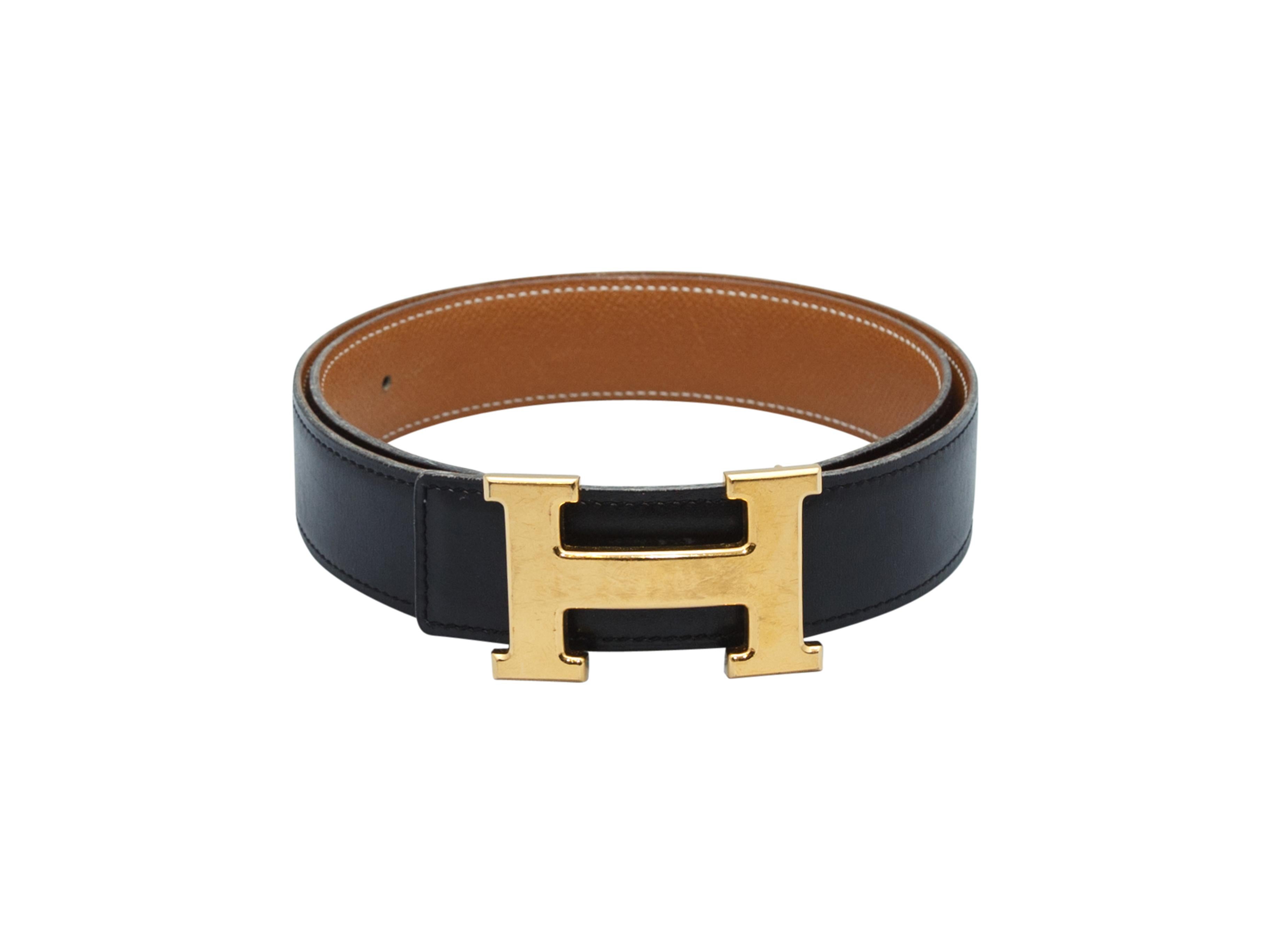 Product details: Black leather belt by Hermes. Large gold-tone H buckle closure at front. 36