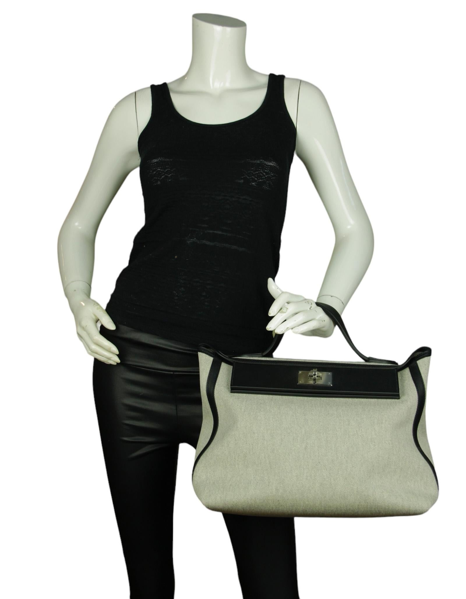 Hermes Black H Viking/ Swift Toile 35cm 24/24 Bag

Made in: France
Year of Production: 2022
Color: Black and beige
Materials: Canvas and swift leather
Lining: Canvas and leather
Hardware: Silvertone palladium
Exterior Pockets: Back patch
Interior