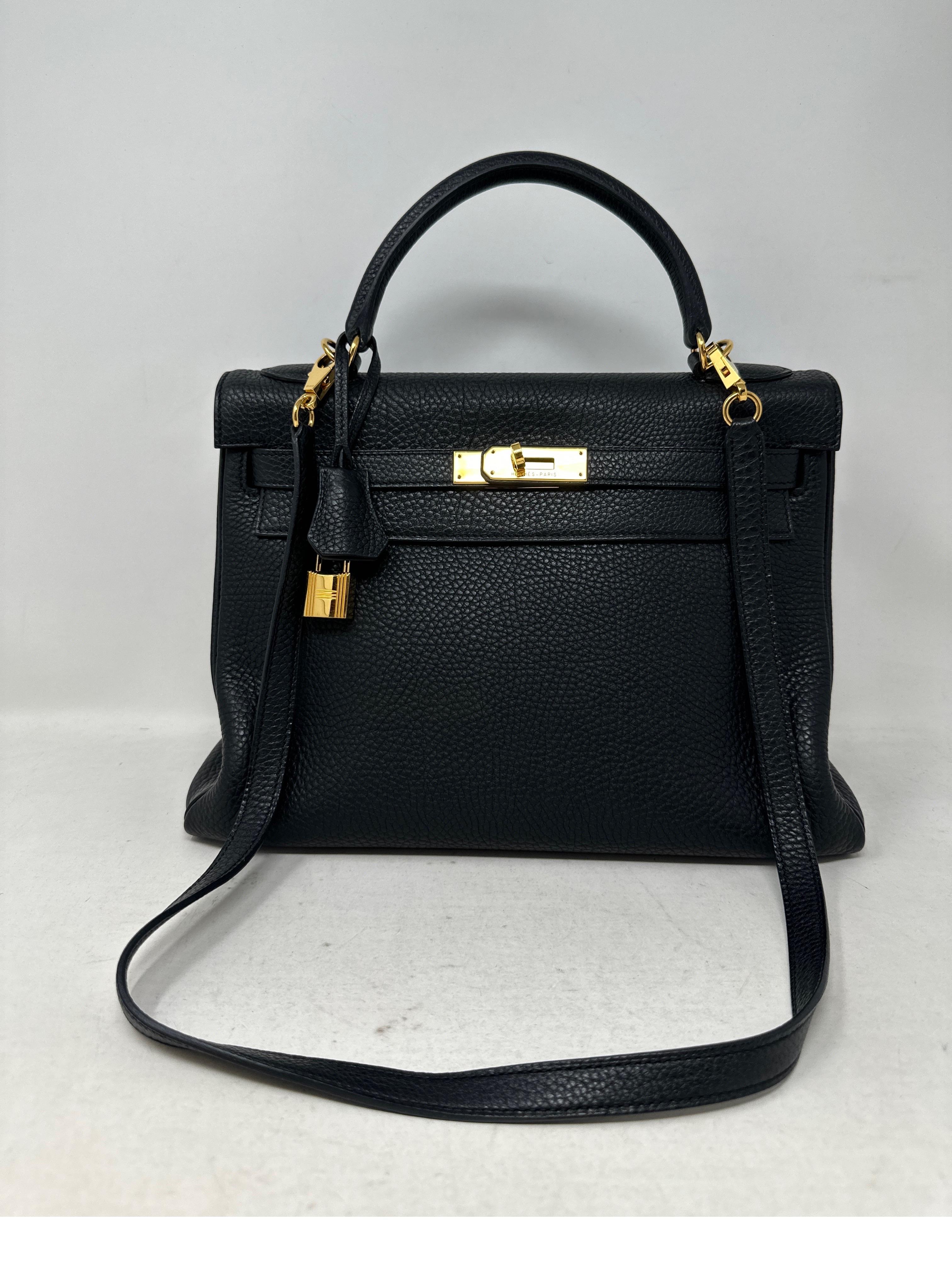 Hermes Black Kelly 28 Bag. Togo leather with gold hardware. Excellent condition. Harder to find size Kelly. Interior clean. Great investment bag. Black with gold is most wanted. Includes clcohette, lock, keys, and dust bag. Guaranteed authentic. 