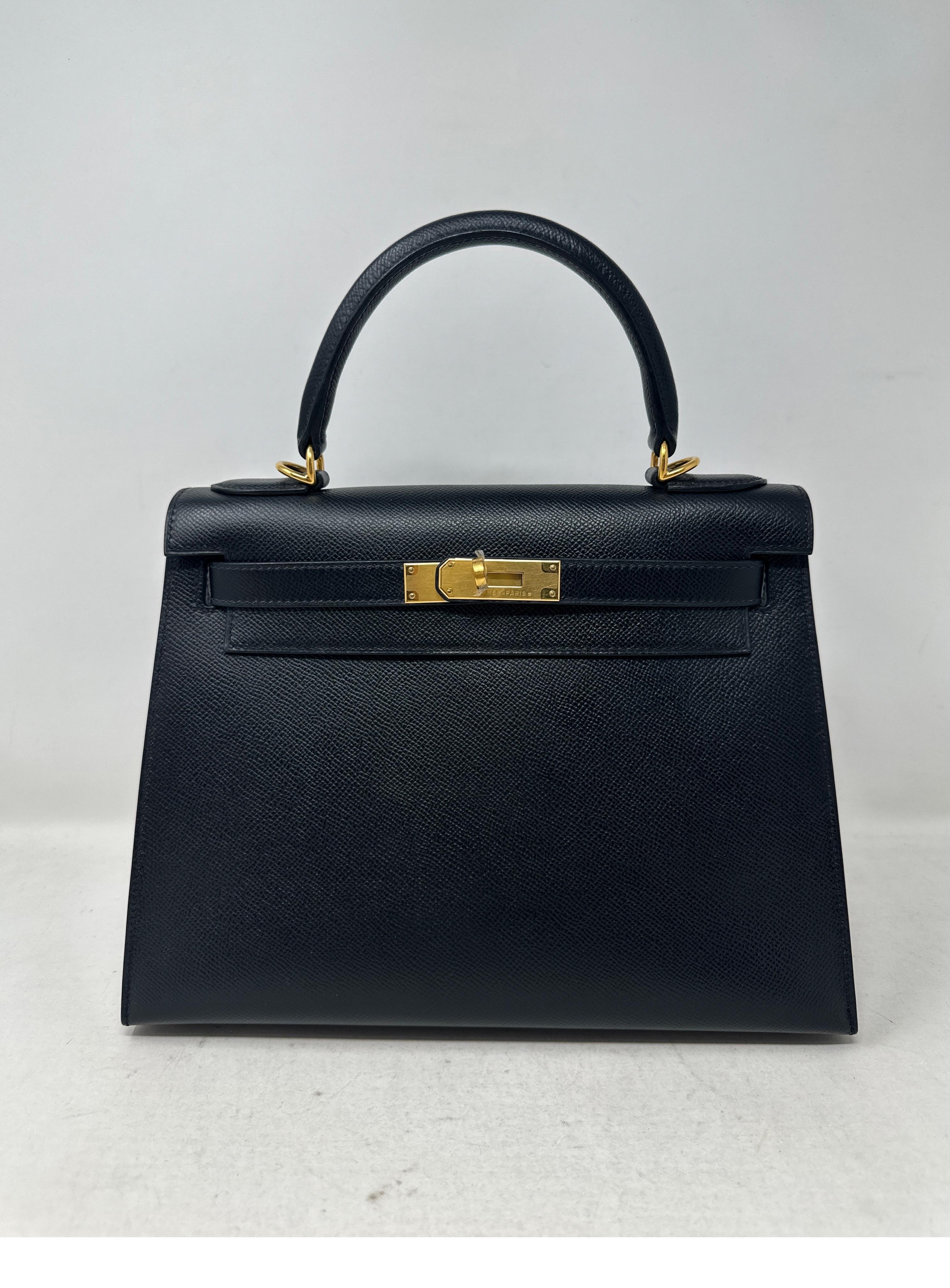 Hermes Black Kelly 28 Bag. Looks new. Excellent condition. Black sellier epsom leather. Gold hardware. Plastic is still on hardware. Never used. Includes clochette, lock ,keys, and dust bag. Guaranteed authentic. 