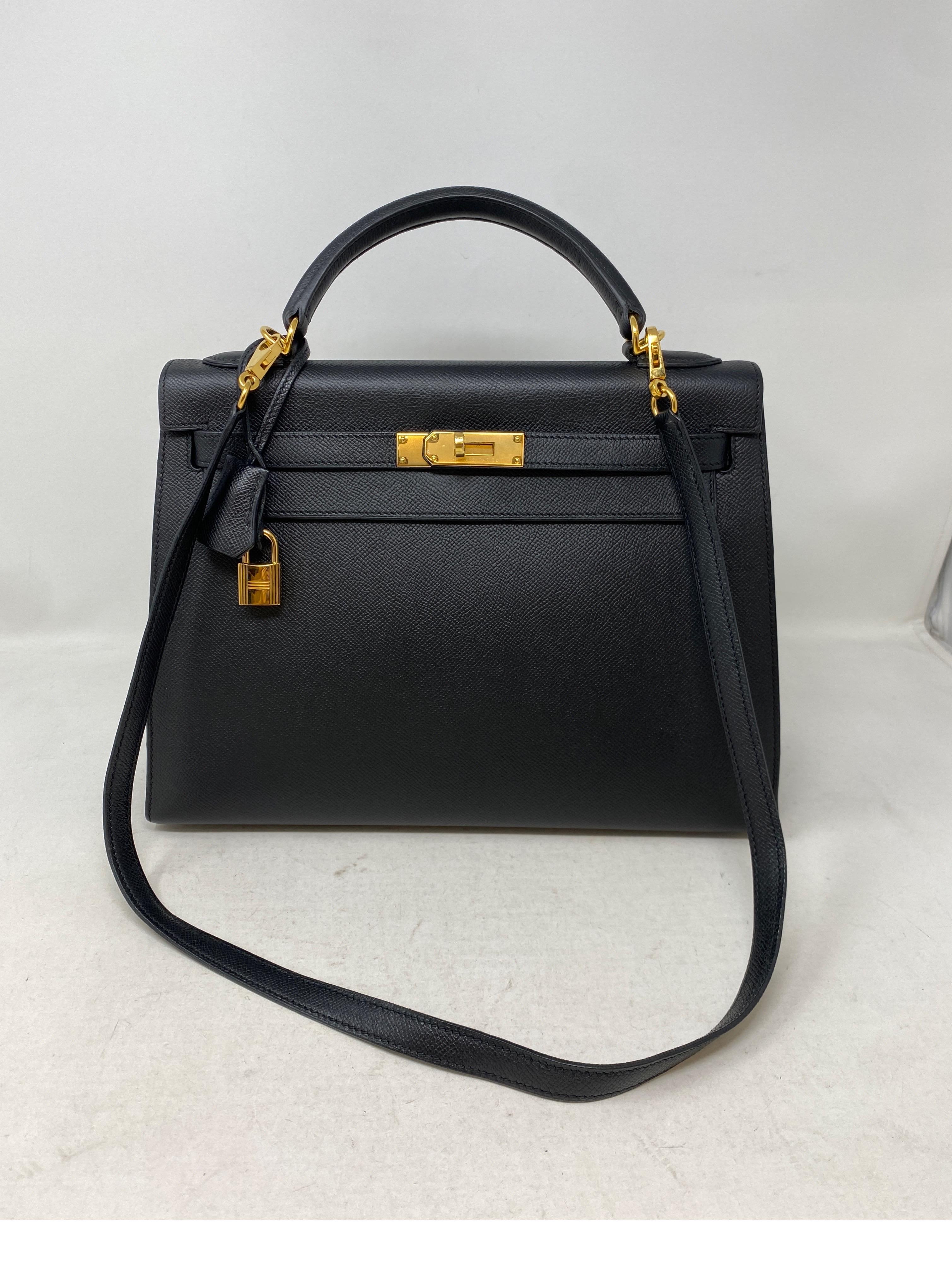 Hermes Black Kelly 32 Bag. Sellier epsom leather with gold hardware. Black Sellier in excellent condition. The Kelly bag is a classic. Can be worn with strap or as a top handle bag. Great structured bag. Gold hardware still has plastic. Interior