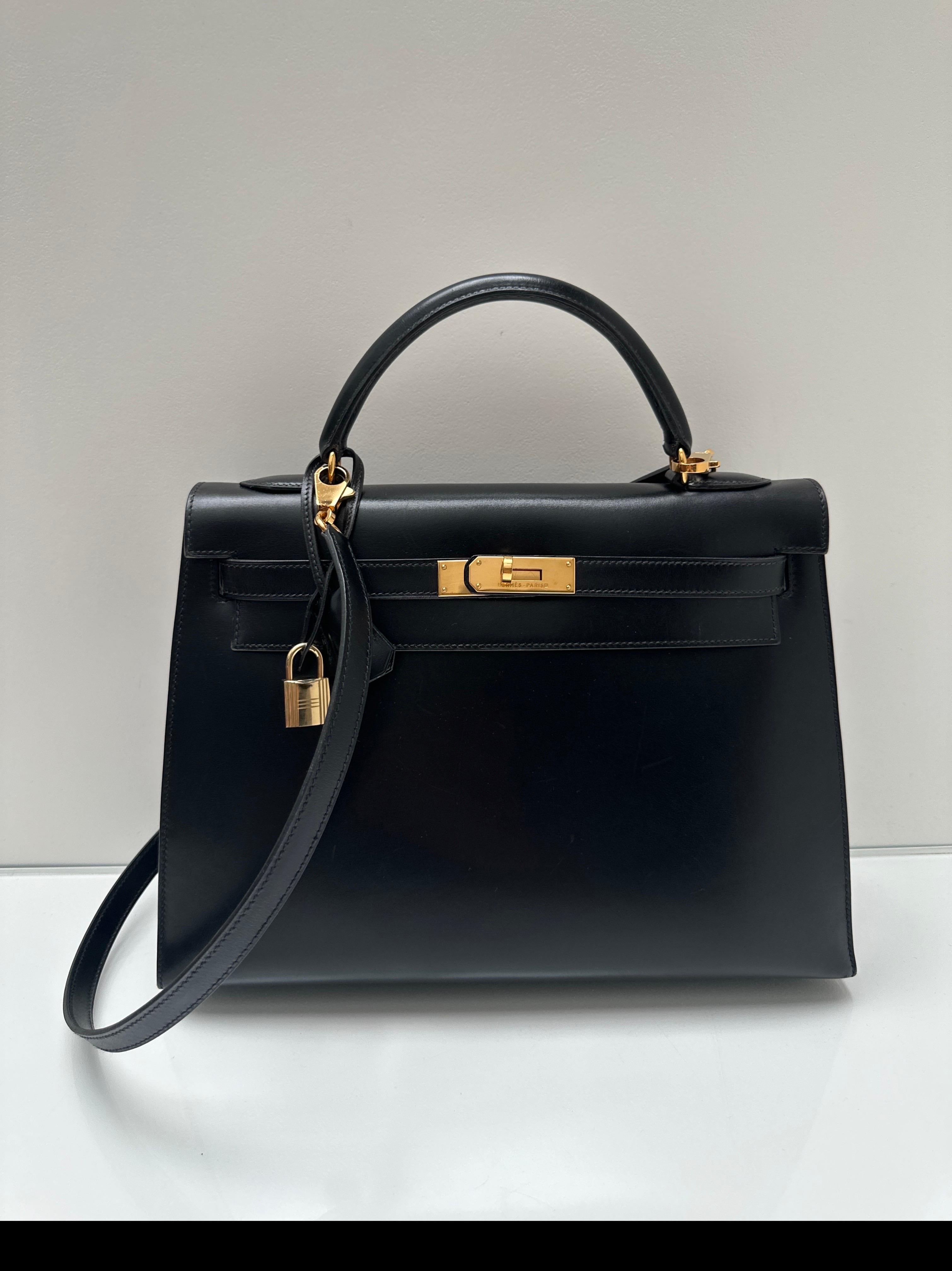 Hermes Black Kelly 32 Bag. Gold hardware. Excellent condition for vintage. Box leather is smooth and beautiful. Kelly bags are back and are a great investment. Includes clochette, lock, keys, and dust bag. Guaranteed authentic. Don't miss out on