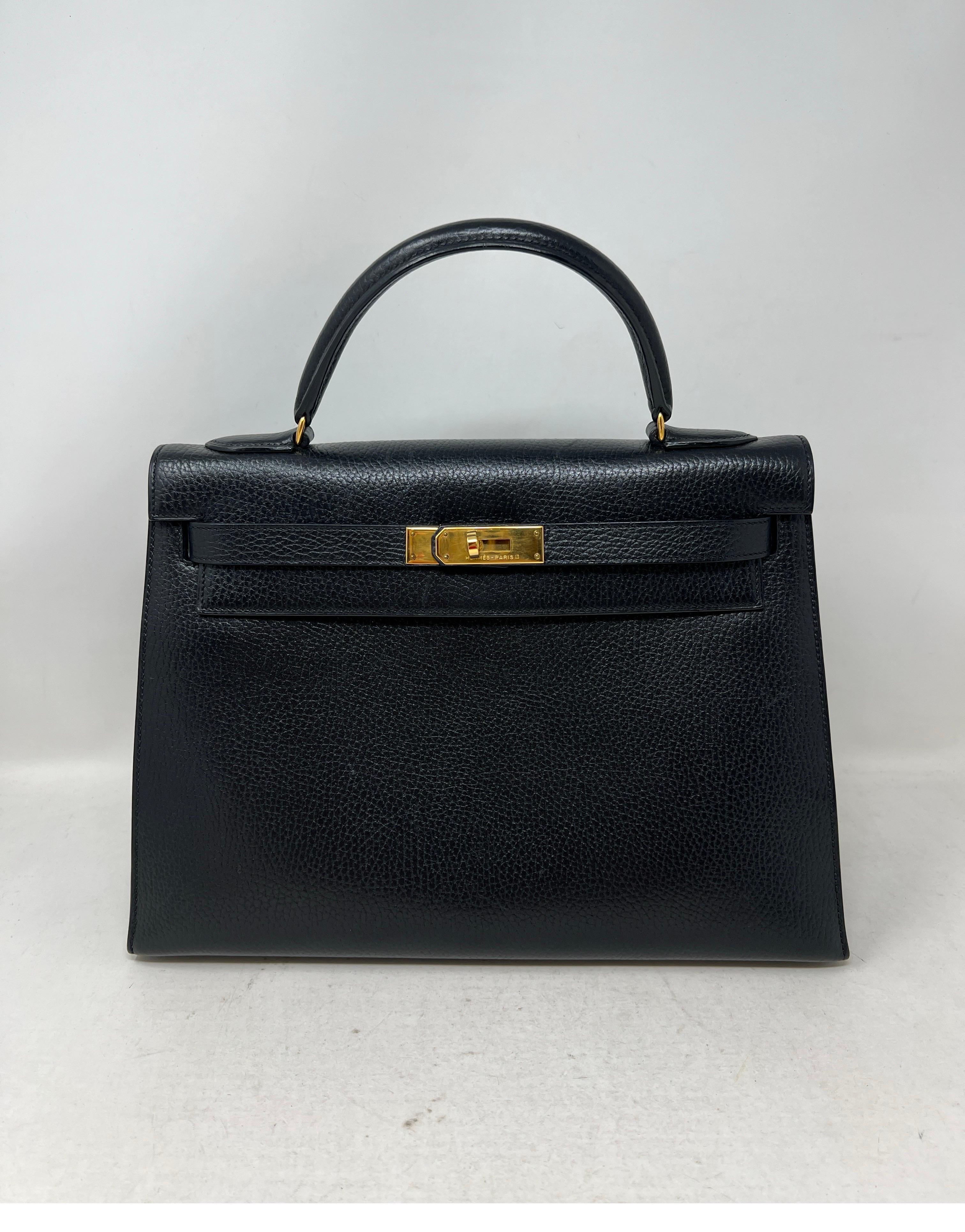 Hermes Black Kelly 32 Bag. Vintage Hermes Sellier Bag. Excellent condition for it's age. Interior clean. Vintage from 1980's. Gold hardware. Includes strap, clochette, lock, keys, and dust bag. Guaranteed authentic. 