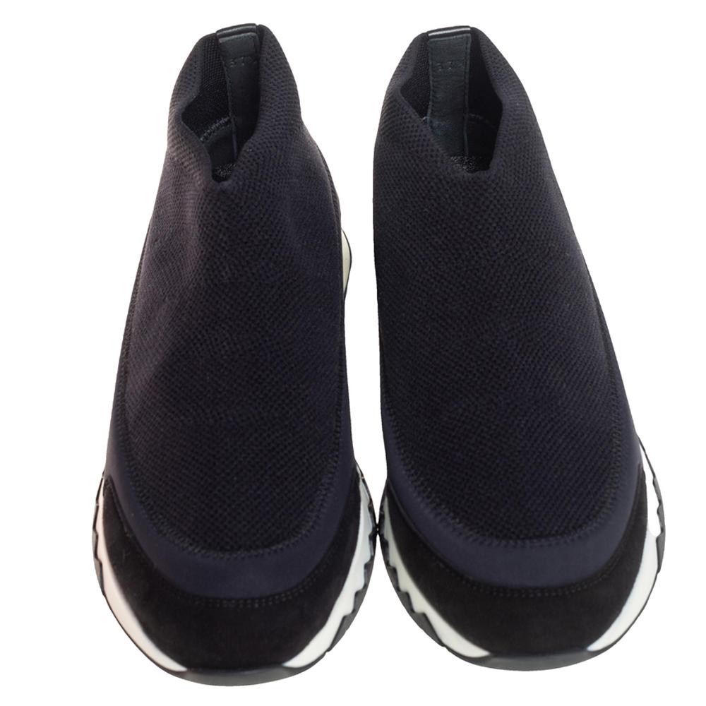 Beautifully crafted in knit fabric, these Hermes slip-on sneakers are sure to offer a luxe style. These black sock-fit shoes, featuring sturdy soles and comfortable leather-lined insoles, will assist you with ease on all days.

Includes: Original