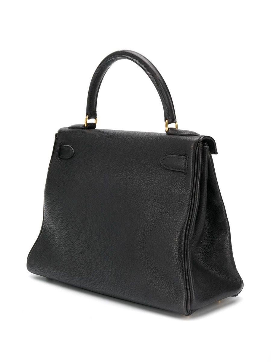 This vintage Kelly bag from Hermès is a true testament to the quality of the house's craftsmanship, exuding timeless style and elegance, perfect for any occasion with Black Togo leather and beautiful gold-tone hardware. The intricate design features