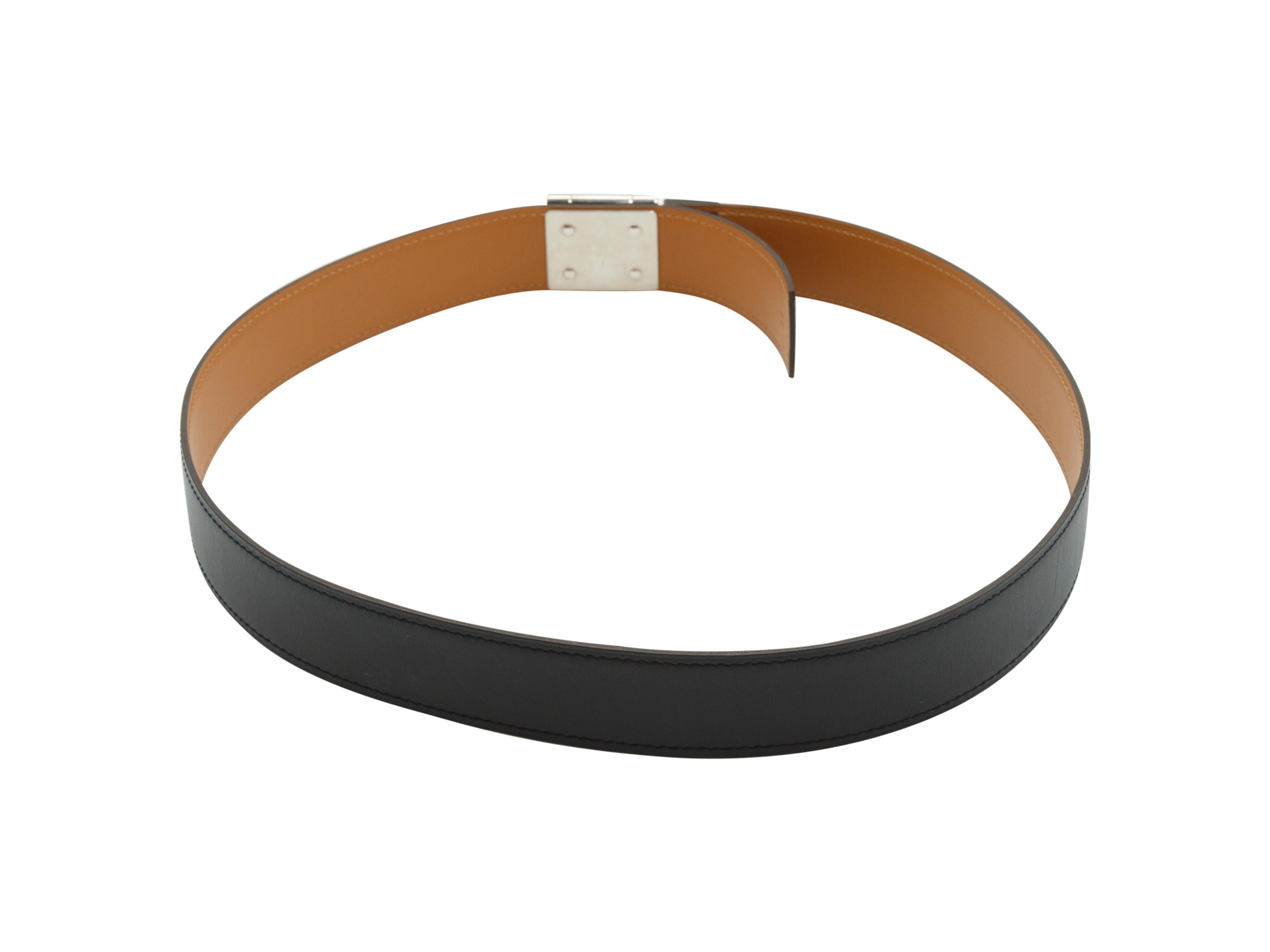 Product details: Black leather belt by Hermes. Tonal stitching throughout. Silver-tone closure at front. Designer size 85. 33