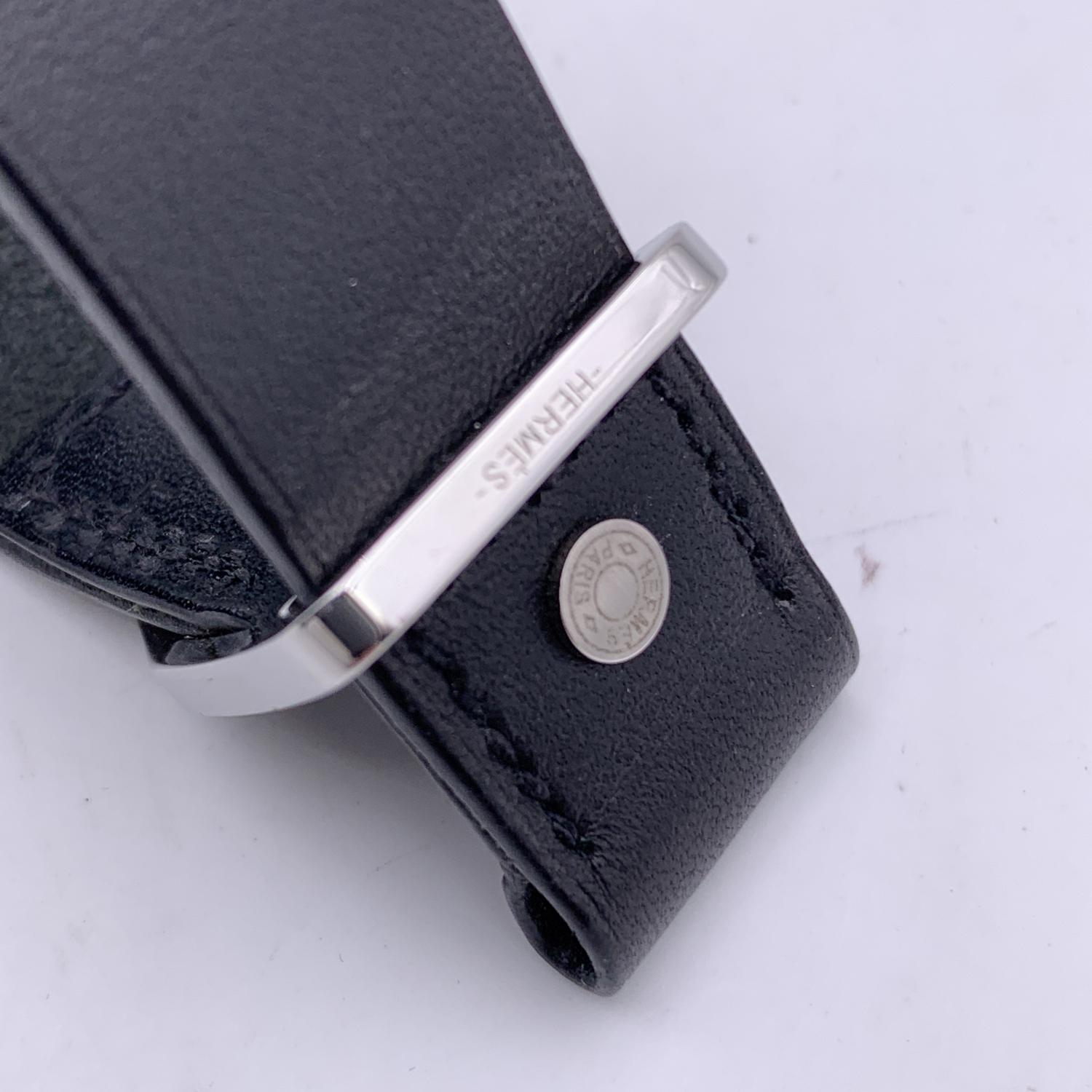 Hermes leather bracelet in black color. Silver buckle. For wrists up to 7 inches - 17.8 cm in circumference. Signed 'Hermes' hardware. Signed hardware. Data code and blind stamp engraved on the reverse of the bracelet. Made in