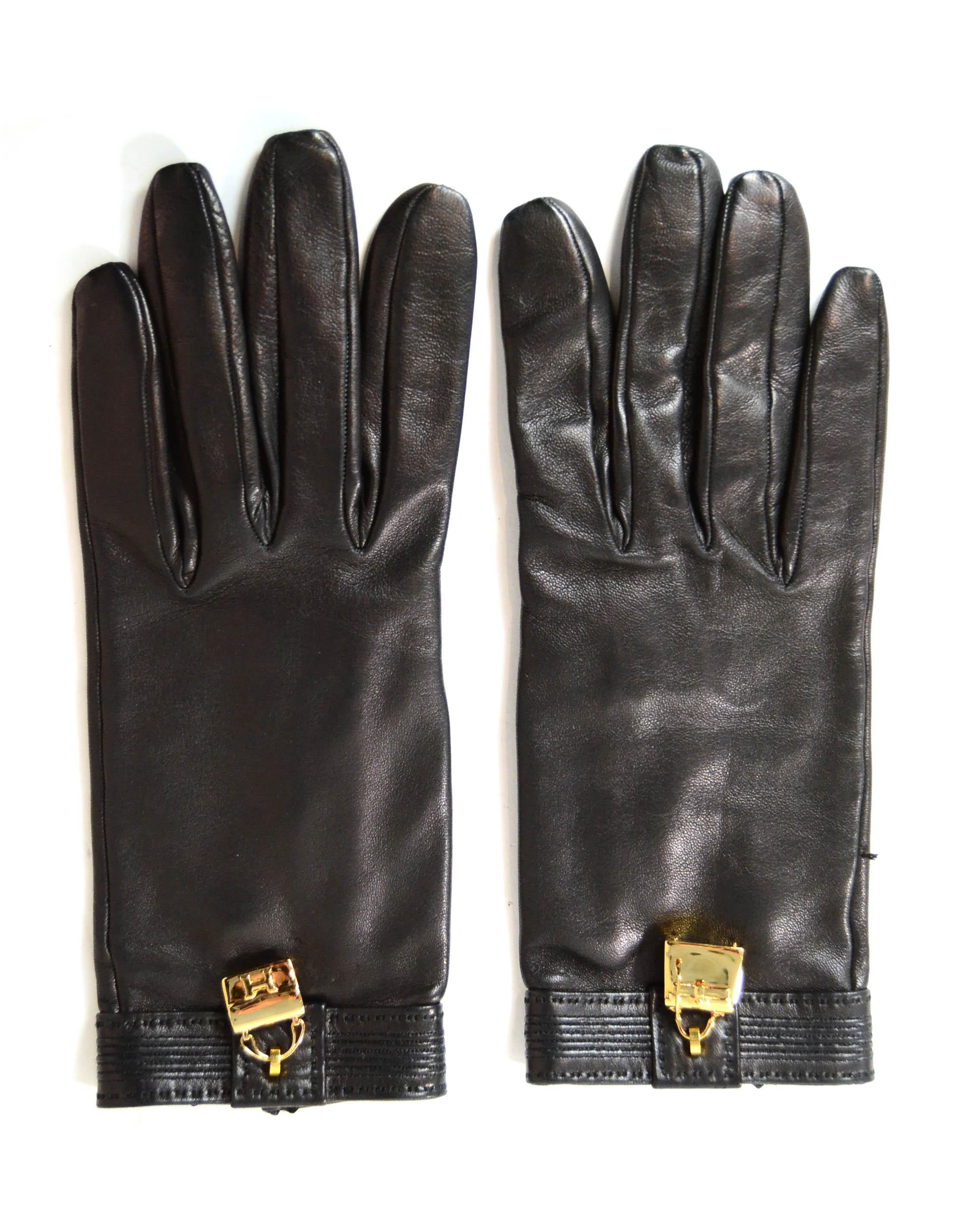 Hermes Black Leather Charm Gloves.  Features one glove with goldtone H constance bag charm and one with a Kelly bag charm.

Made In: France
Color: Black
Hardware: Goldtone
Materials: Leather
Overall Condition: Excellent - some piling to