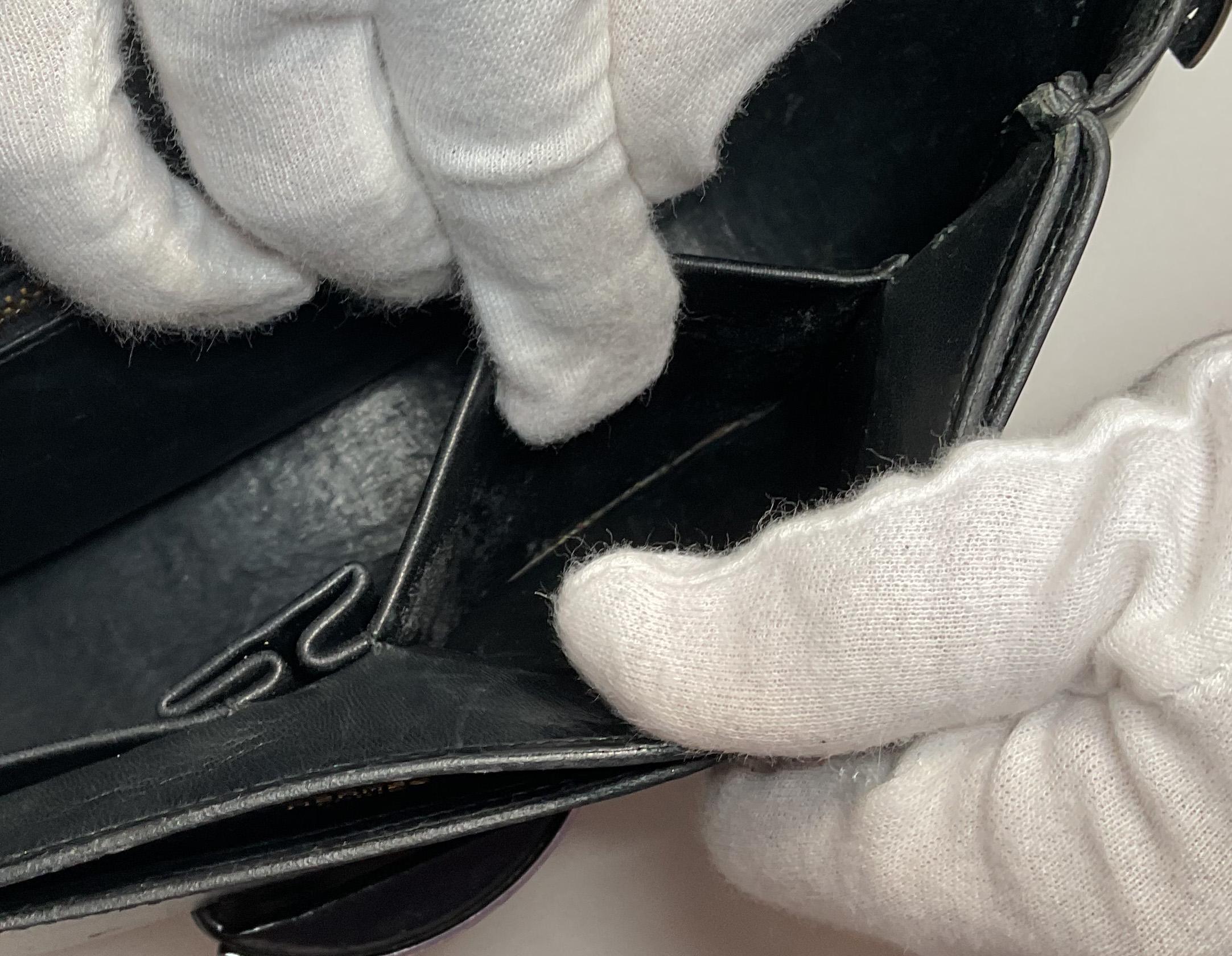 HERMÈS Black Leather Crossbody Bag with Silver Buckle and Adjustable Strap For Sale 6
