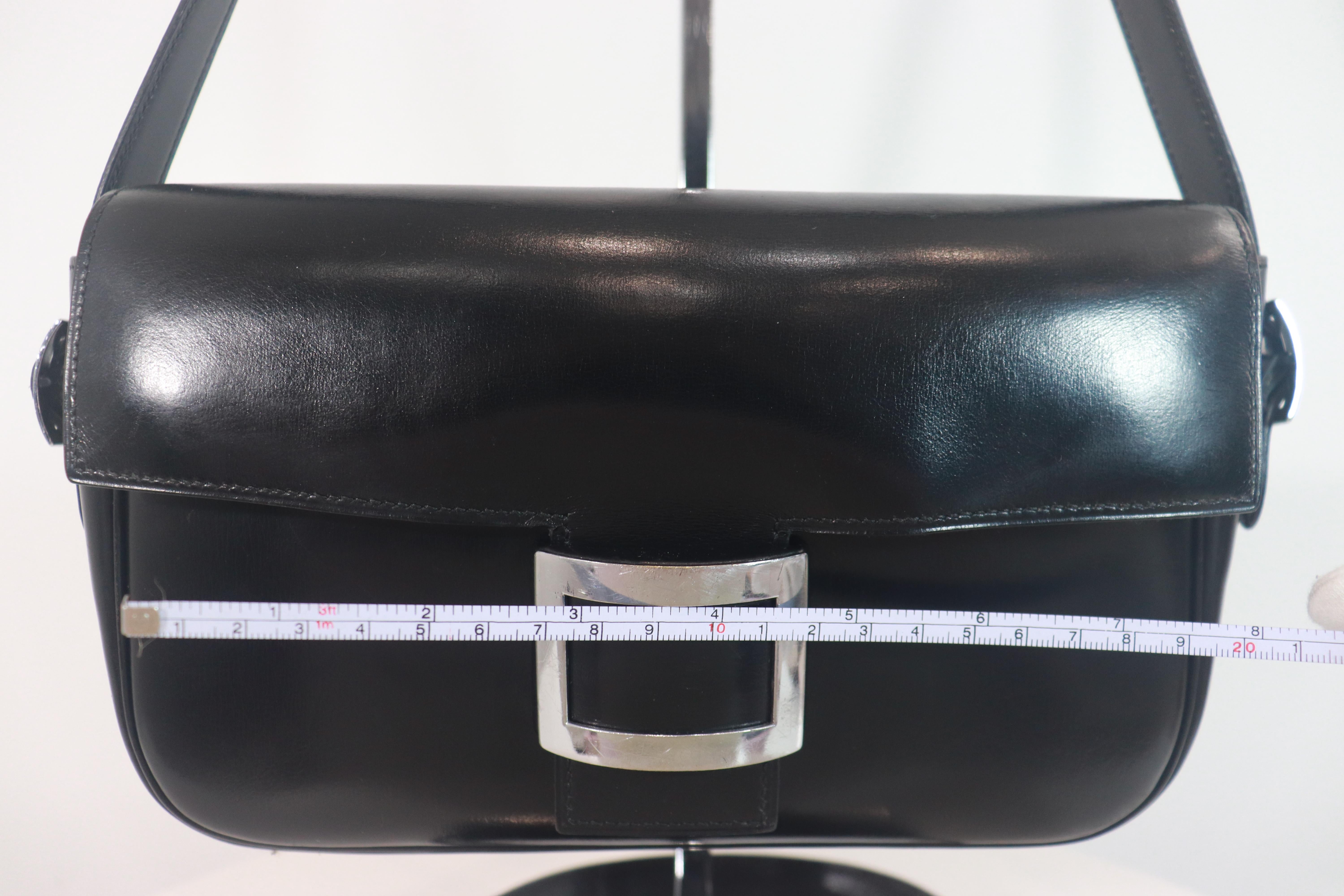 Hermès black leather crossbody bag with silver buckle and adjustable strap. This crossbody bag is in 'LIKE NEW' condition. There are no significant flaws or wear areas to consider with this lovely crossbody bag. It had been very gently used and