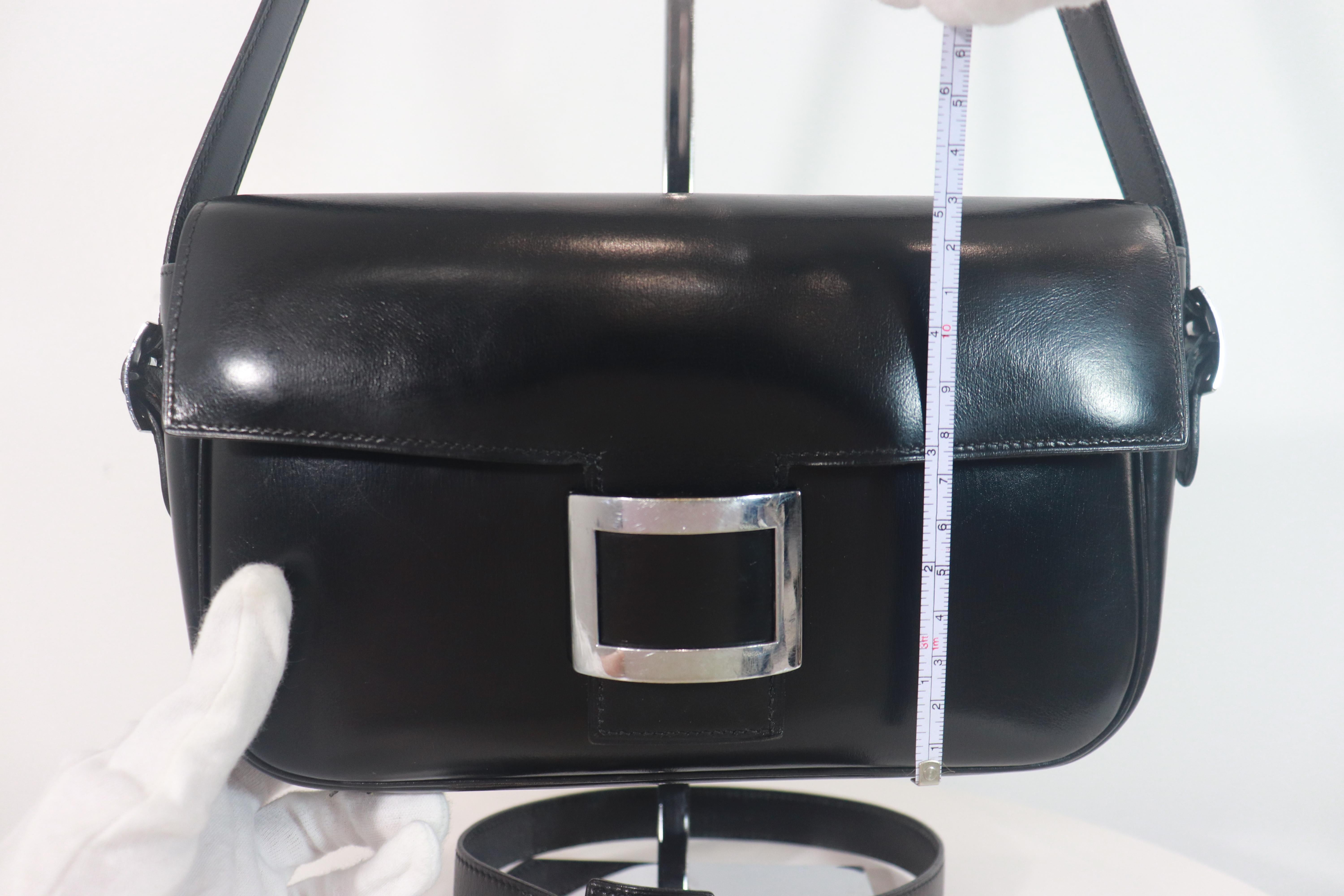 Women's HERMÈS Black Leather Crossbody Bag with Silver Buckle and Adjustable Strap For Sale