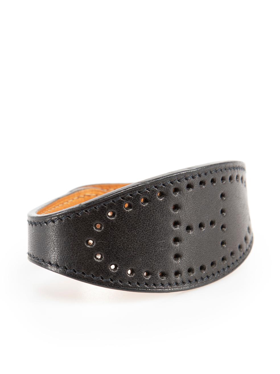 CONDITION is Very good. Minimal wear to bracelet is evident. Minimal wear to the leather underside with very light mark by the fastening on this used Hermès designer resale item.

Details
Evelyne
Black
Leather
Bracelet
Perforated logo detail
Snap