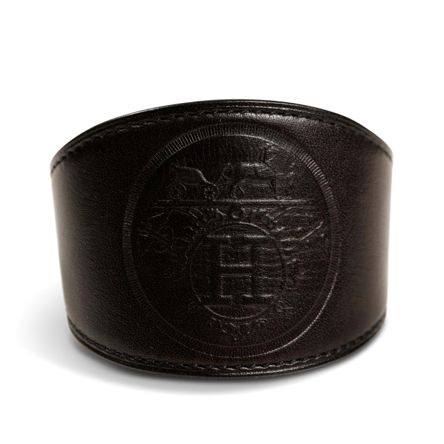 Hermès Black Leather Ex Libris Cuff Bracelet-  Excellent Condition
  The simple design can be worn with anything year-round and is equally suitable for both men and women.  Black leather wide cuff has stamped imprint of Ex Libris design- iconic