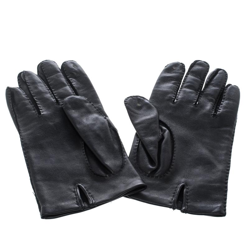 A truly stellar addition to your closet would be these gloves from Hermes. They've been meticulously crafted from lambskin leather and styled with neat stitching and Hermes buttons. The black gloves are complete with soft fabric lining.

Includes: