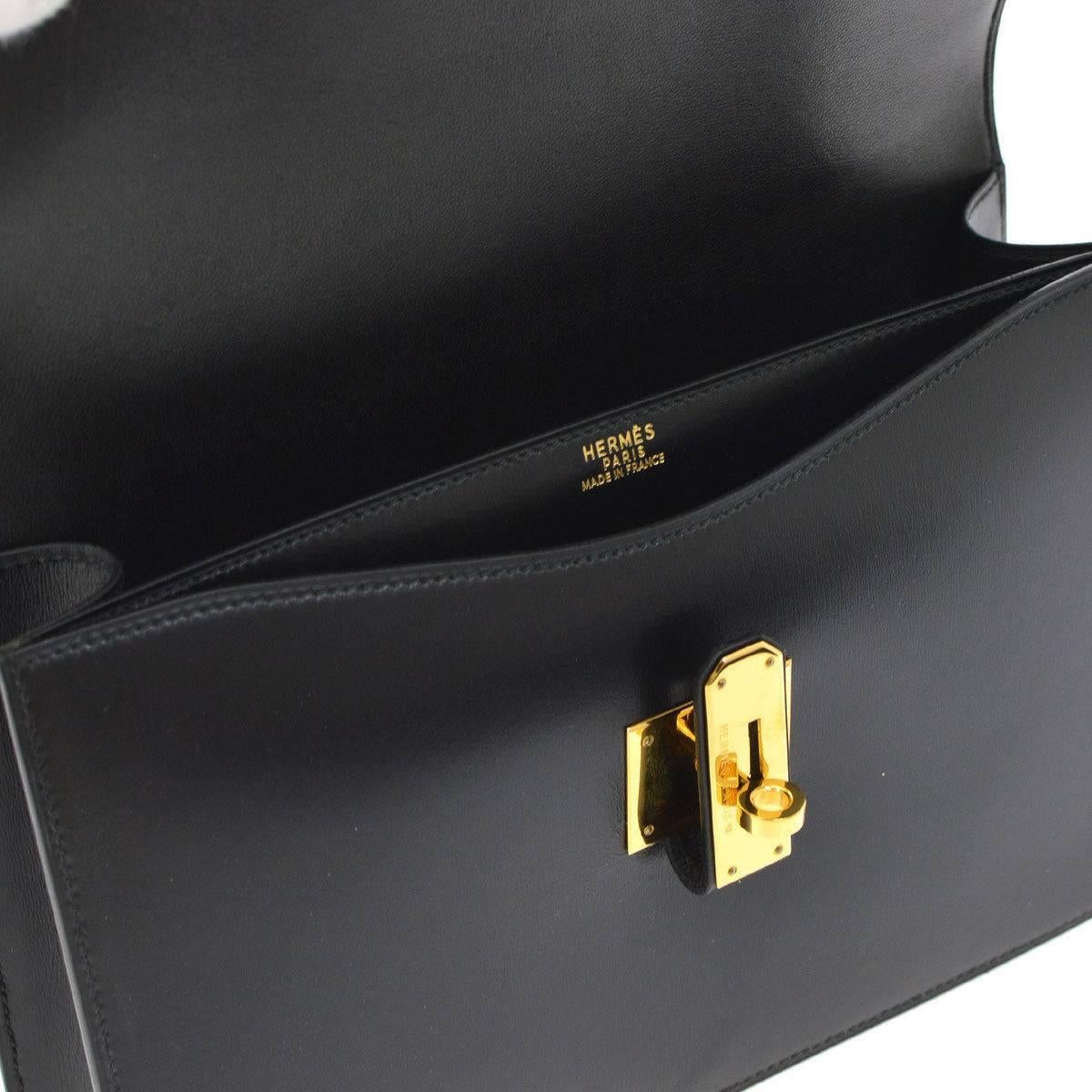 Hermes Black Leather Gold Kelly Style Flip Lock Top Handle Satchel Bag in Box

Leather
Gold tone hardware
Leather lining
Made in France
Handle drop 4