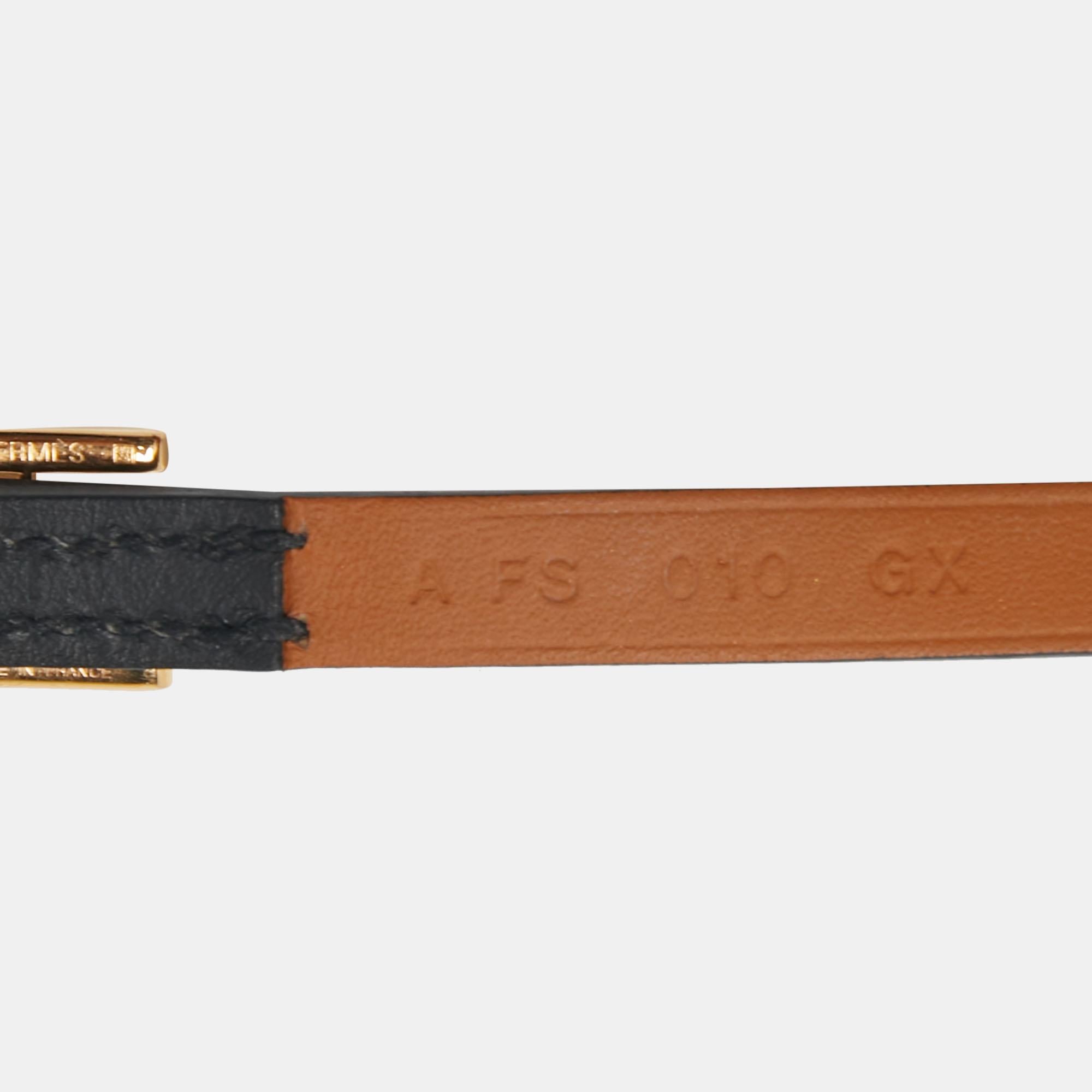 
This Hermès Hapi 3 wrap bracelet is a smart accessory that can be paired well with your casual looks. Made from leather in a black shade, it is accented with a gold-plated buckle sculpted in the shape of the iconic 'H'. The bracelet has a long